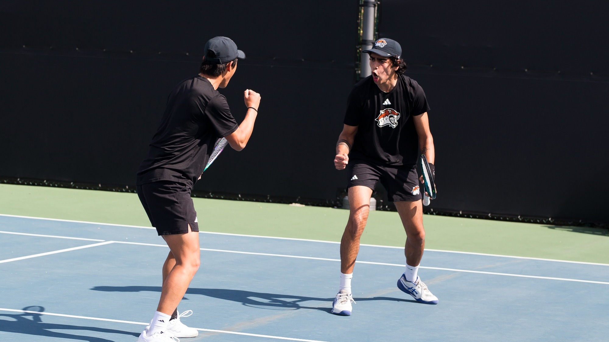 Dhruv Verma and Ronald Chen celebrating a doubles point