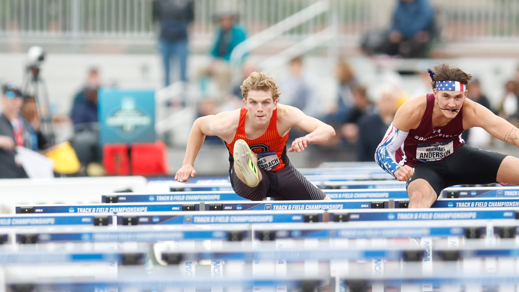James Buellesbach soaring over the hurdles at the ncaa championships