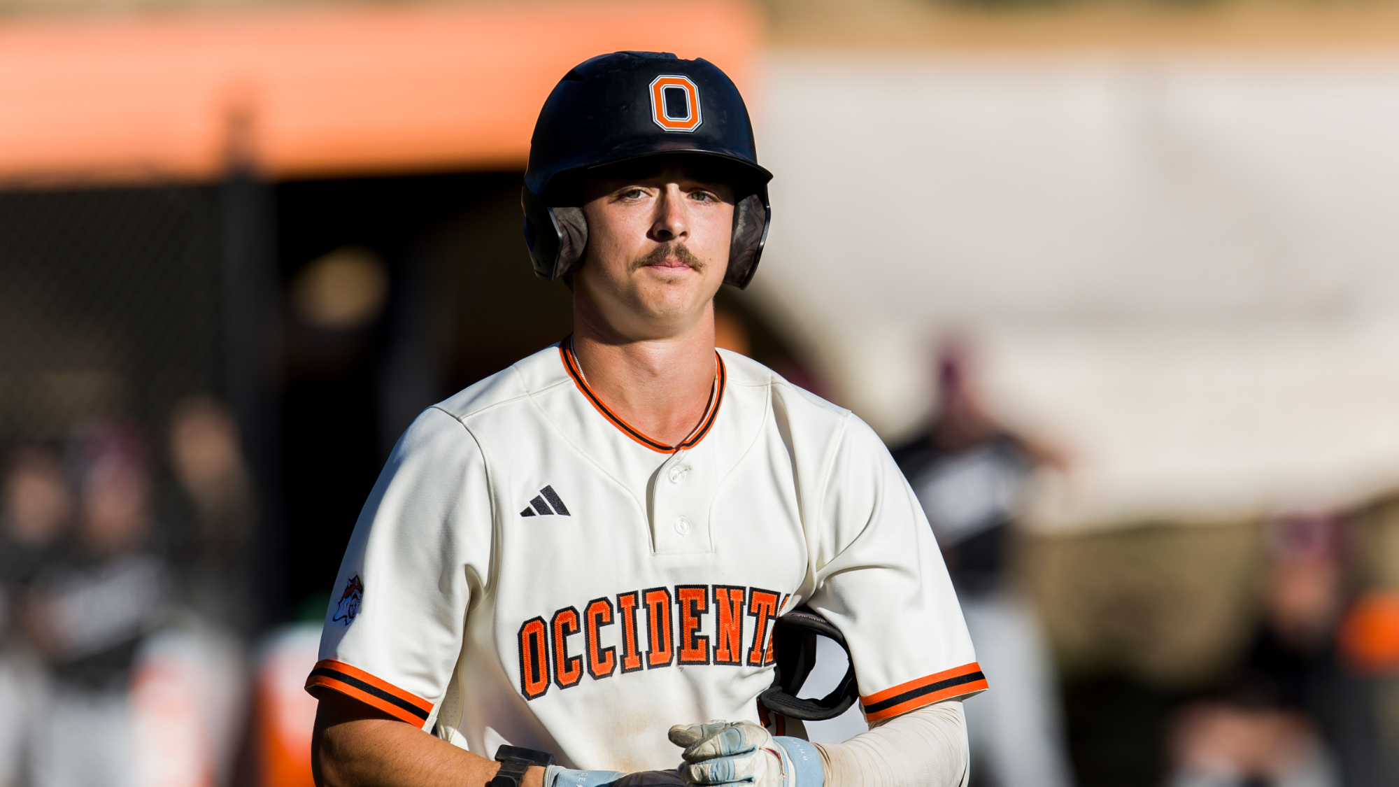Griffen Rogers heads to first base after taking a walk