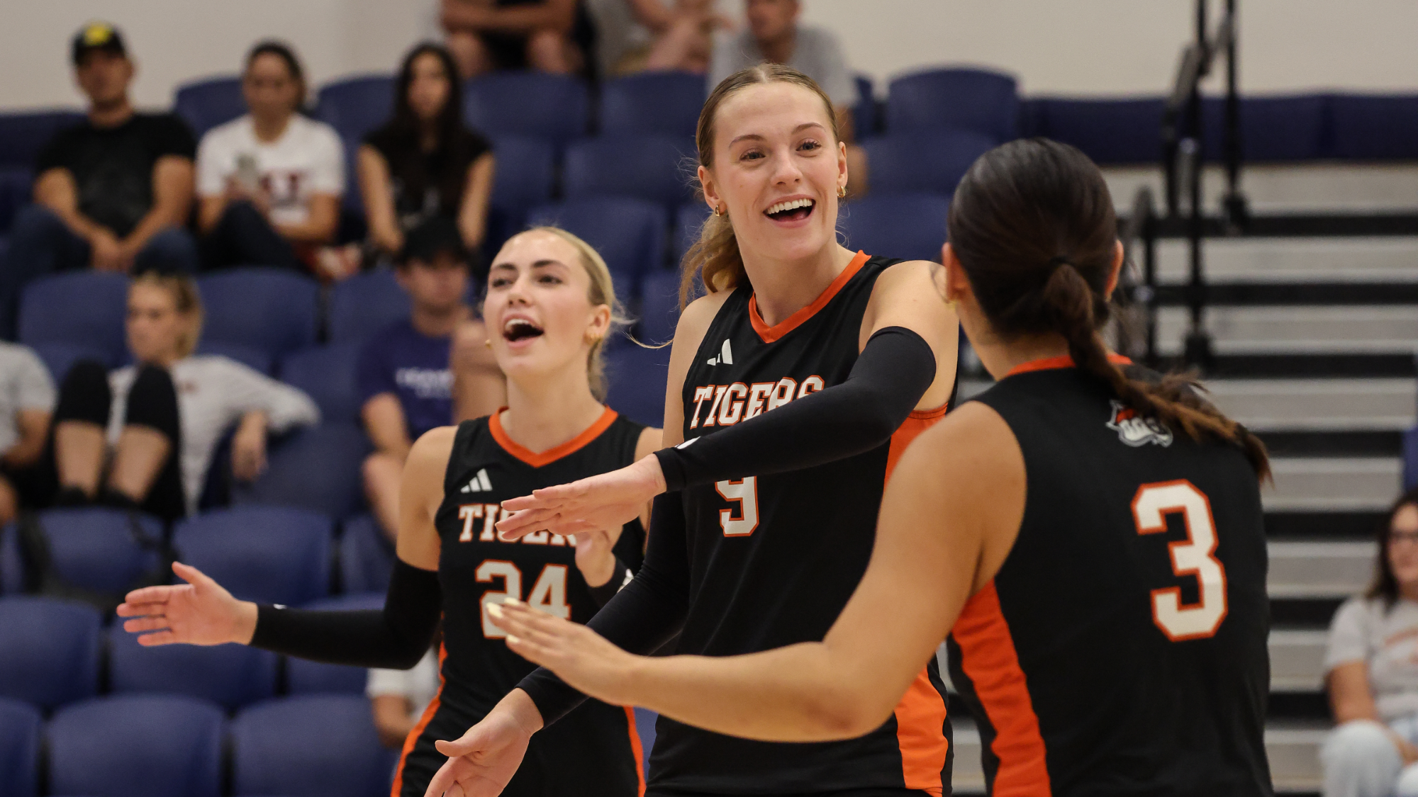 Anna Curtis Revelle celebrates winning a point