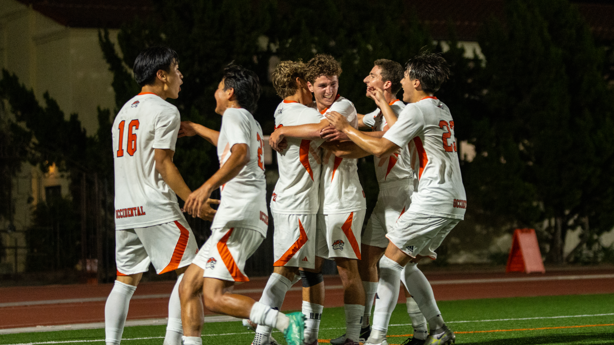Men's soccer celebrates a goal at home