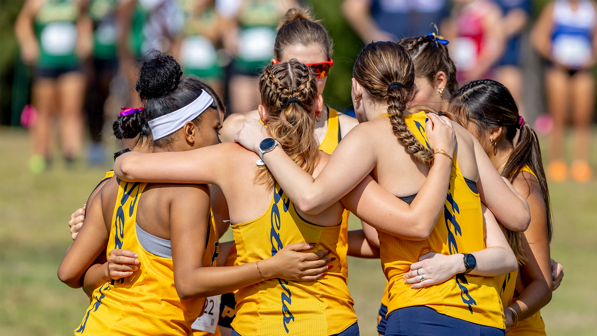 2025 Women's Cross Country Team Huddle Action Shot