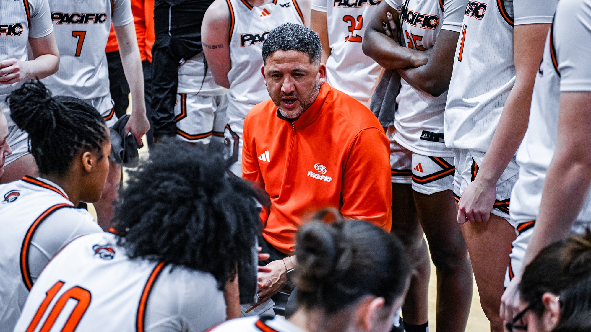 Bradley Davis coaching in the huddle vs. USF 2026