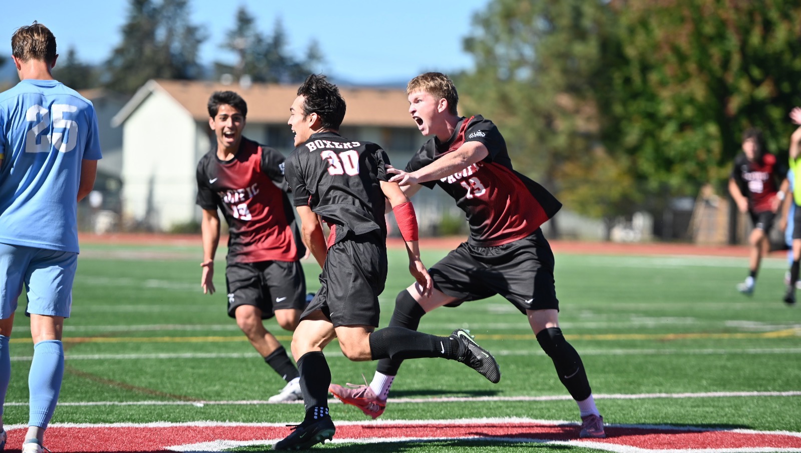 men's soccer celebration