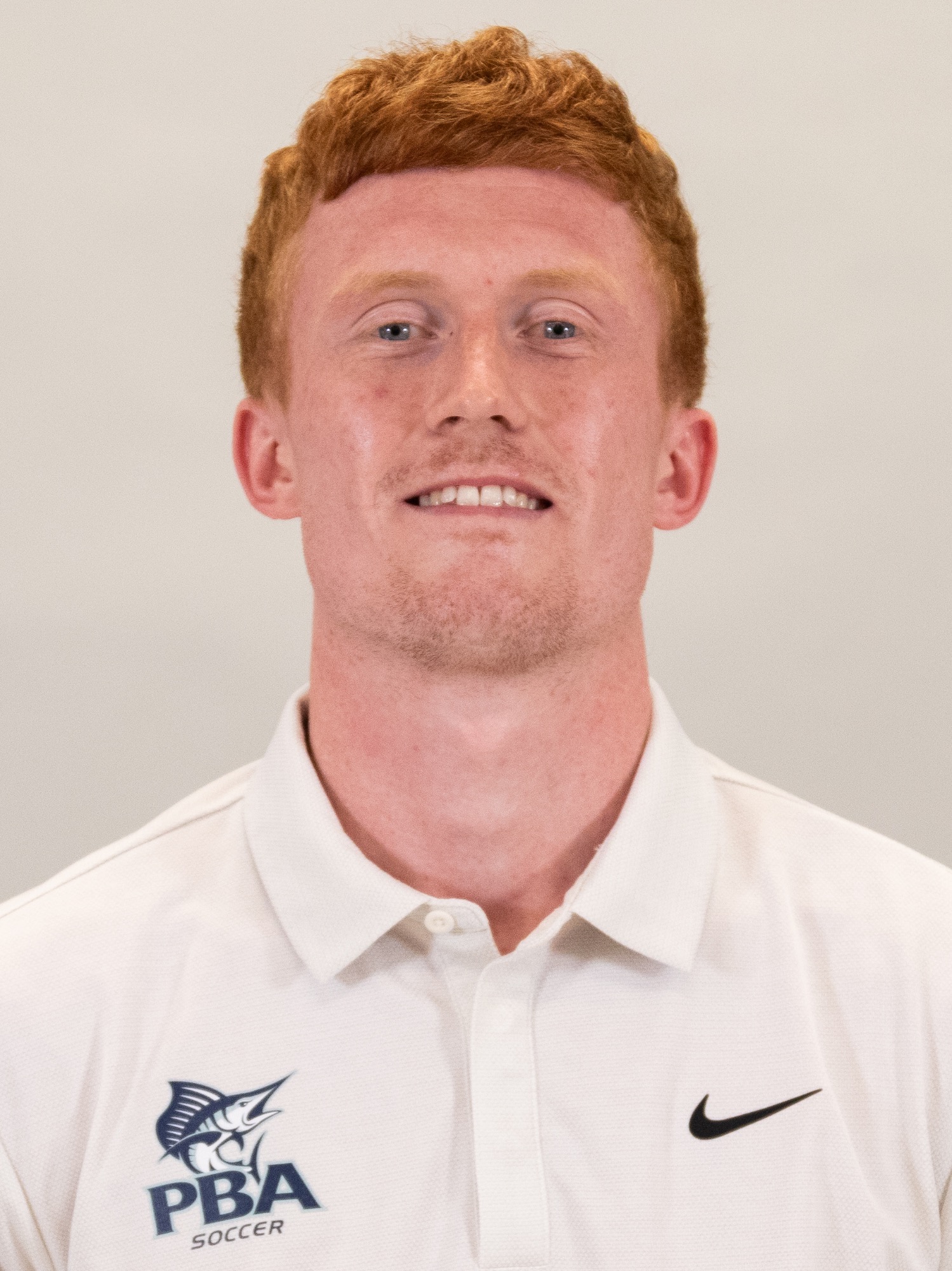 Jake Strachan coach headshot 2025