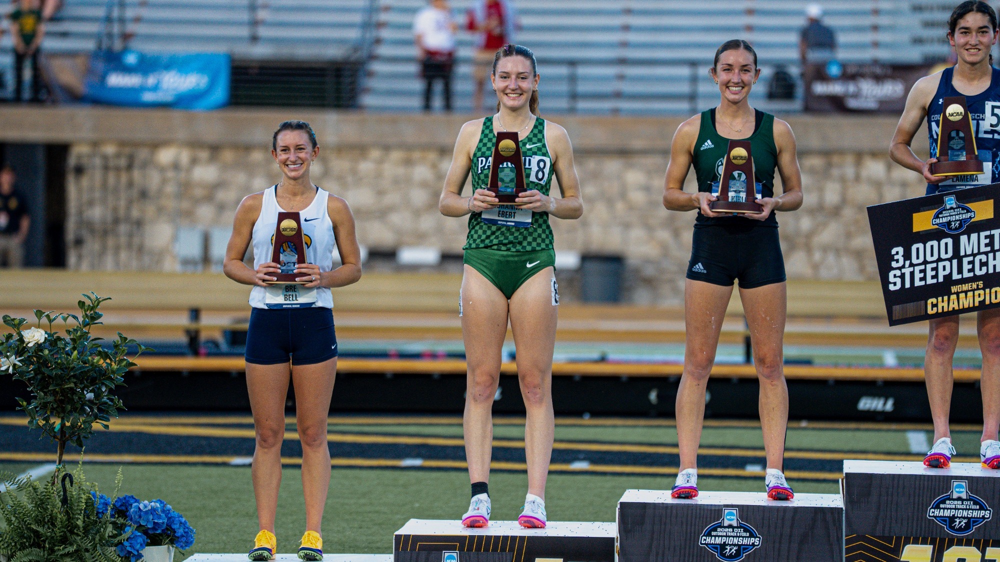 Johanna Ebert holding trophy at NCAA Championships