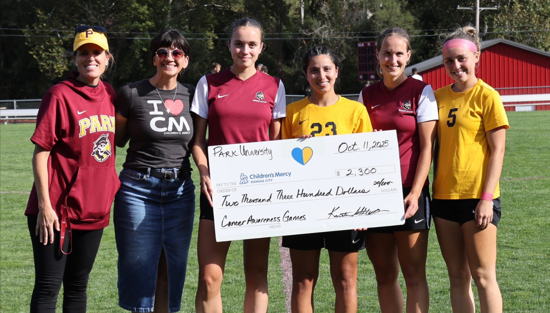 cancer awareness game check presentation to children's mercy 10.11.25