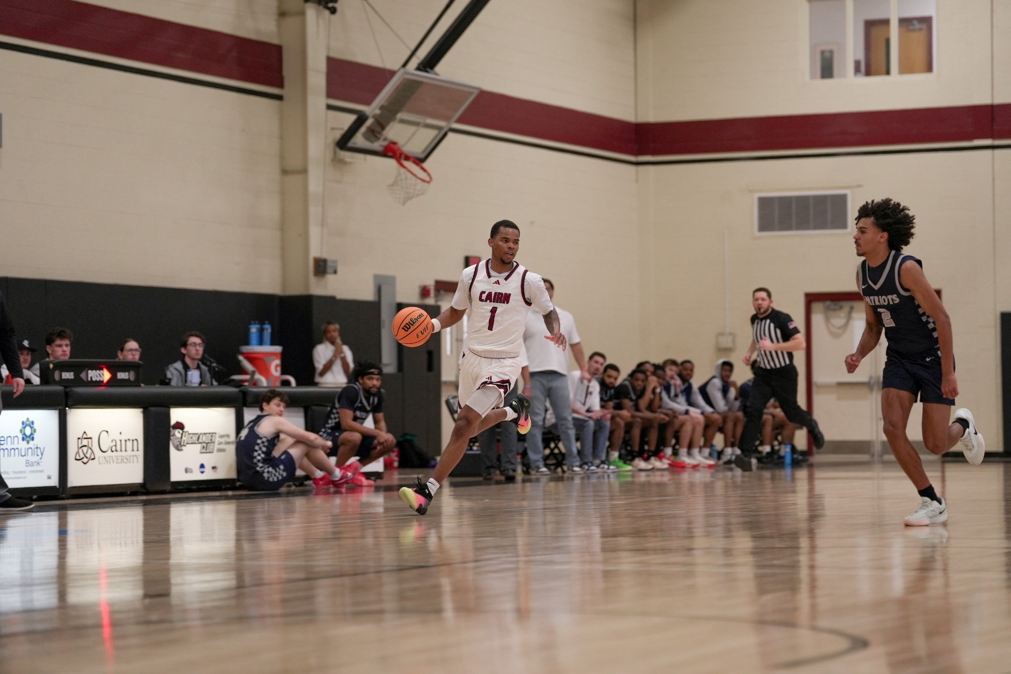 Ron Ayers brings the ball up the court