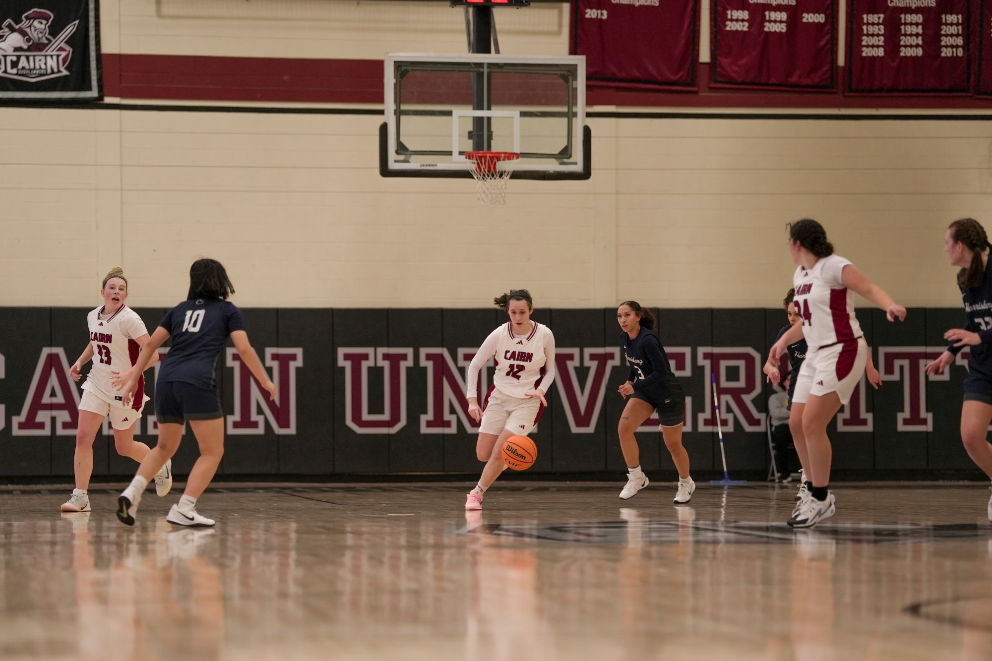 Tatiana Ipri dodges the defense while bringing the ball up the court