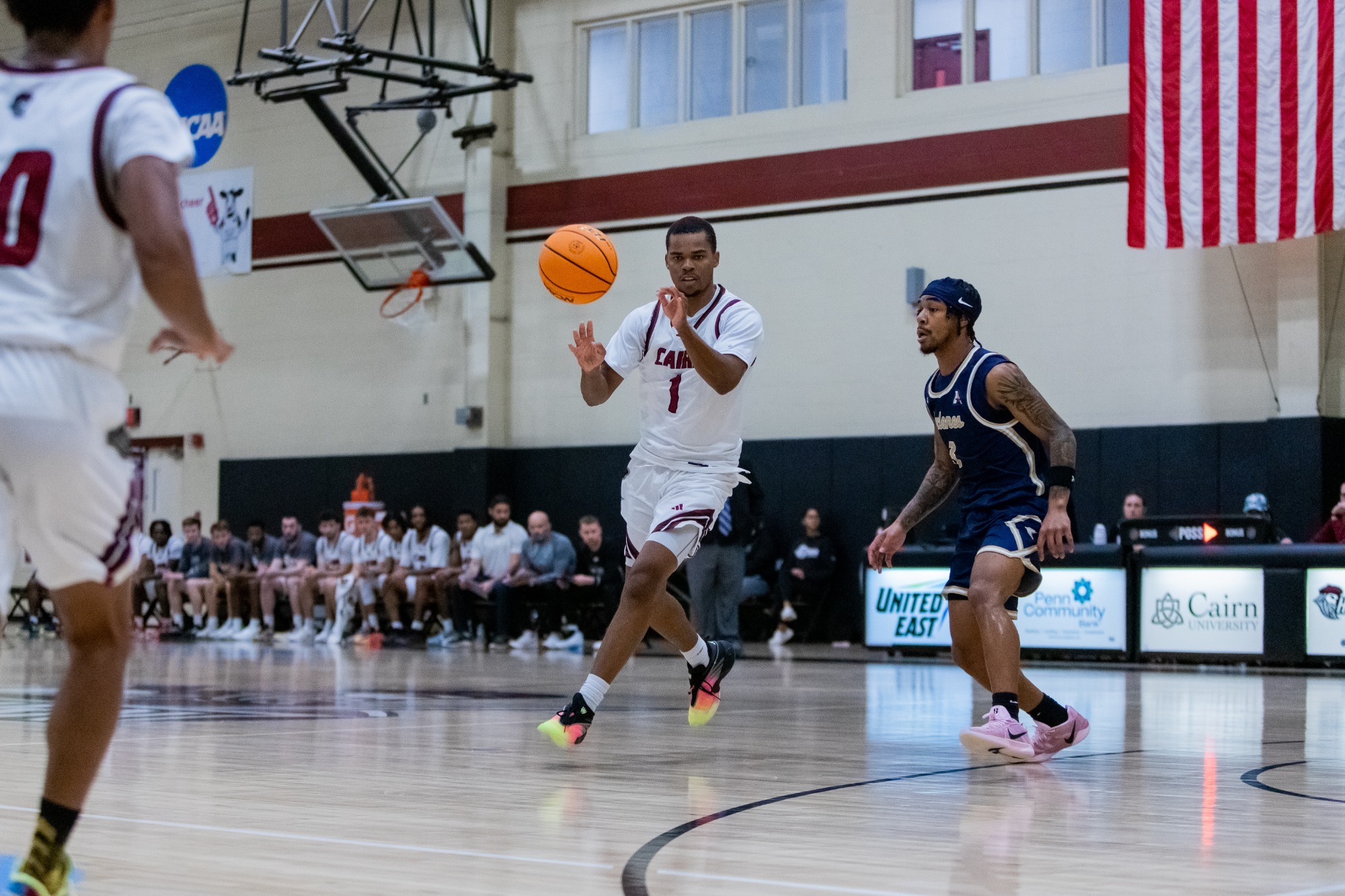Ron Ayers receiving a pass from a teammate