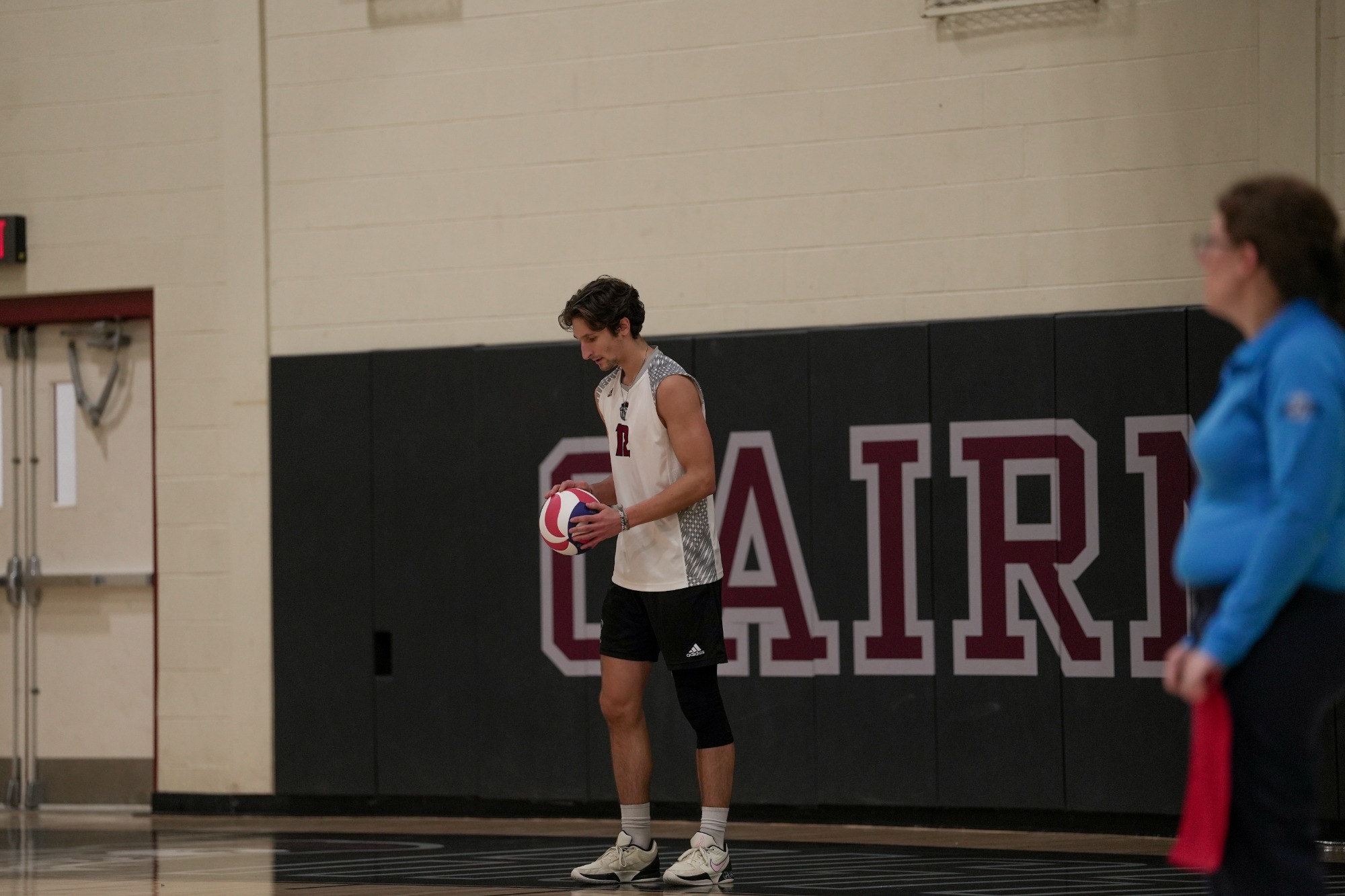 Sam Poirier prepares to serve