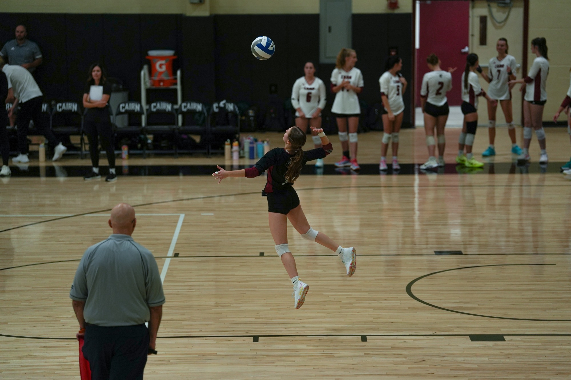 Magazzu serves a volleyball