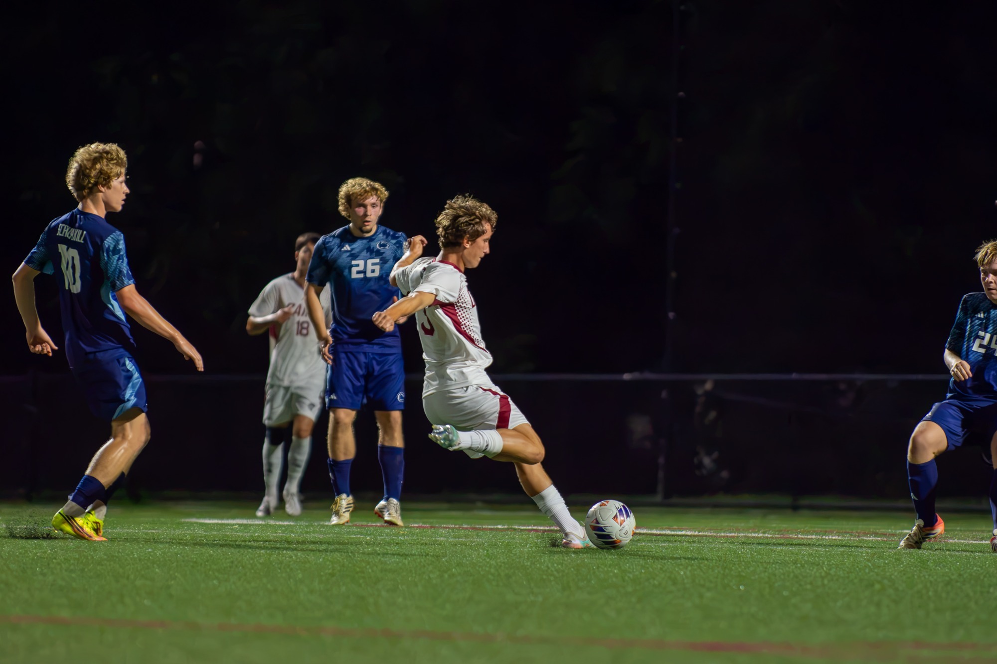 Highlander Soccer player kicks ball