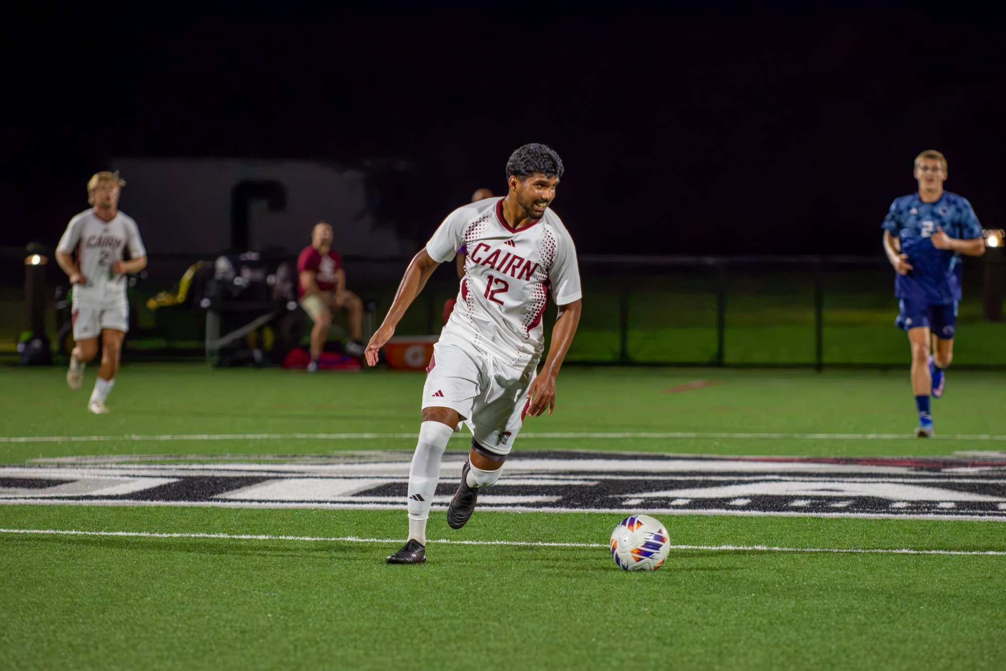 Kalapala dribbles the Soccer ball