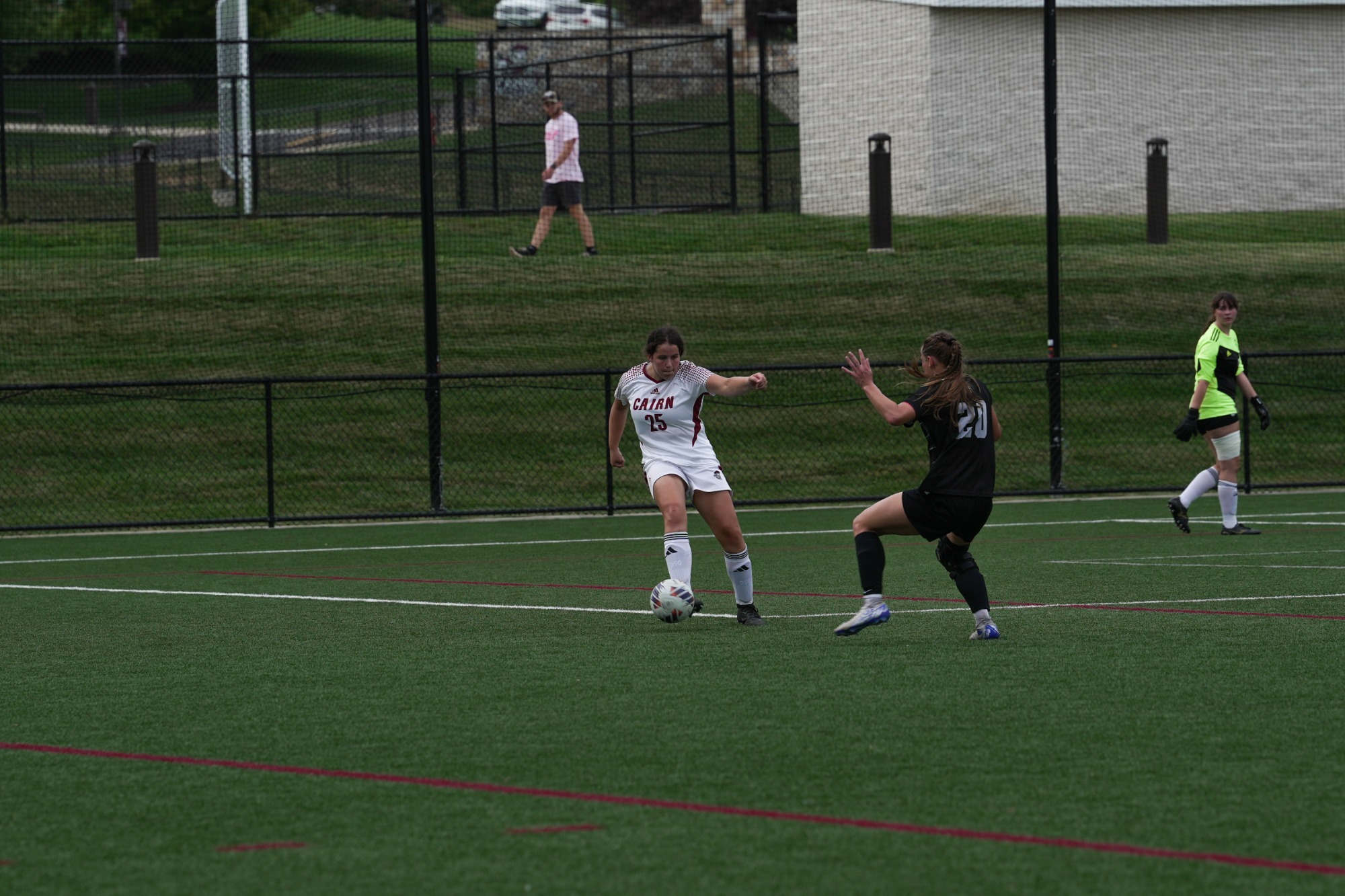 Cramer dribbles past a defender