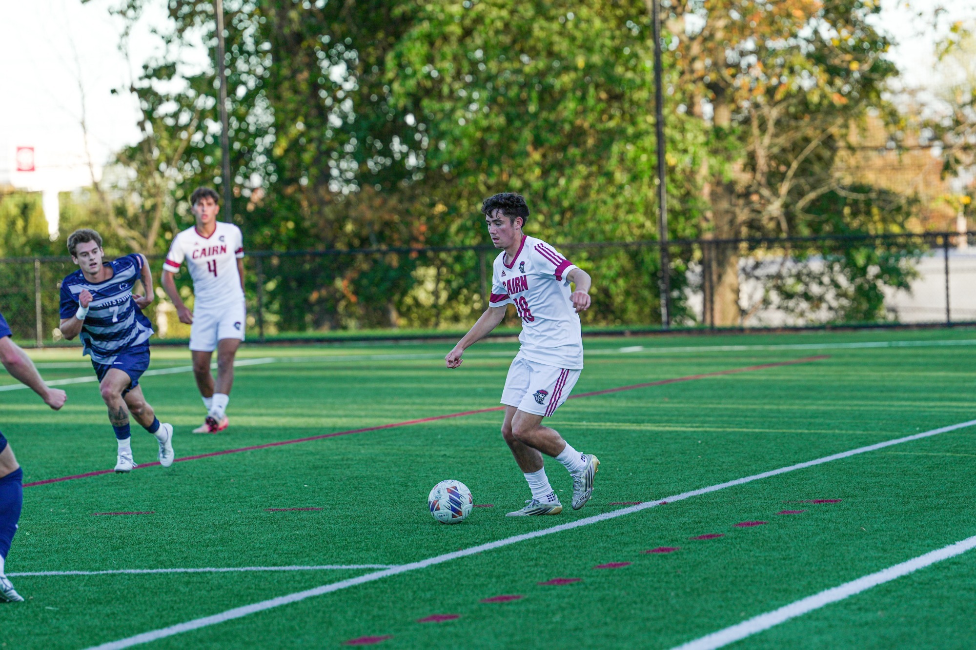 Soccer player kicks ball