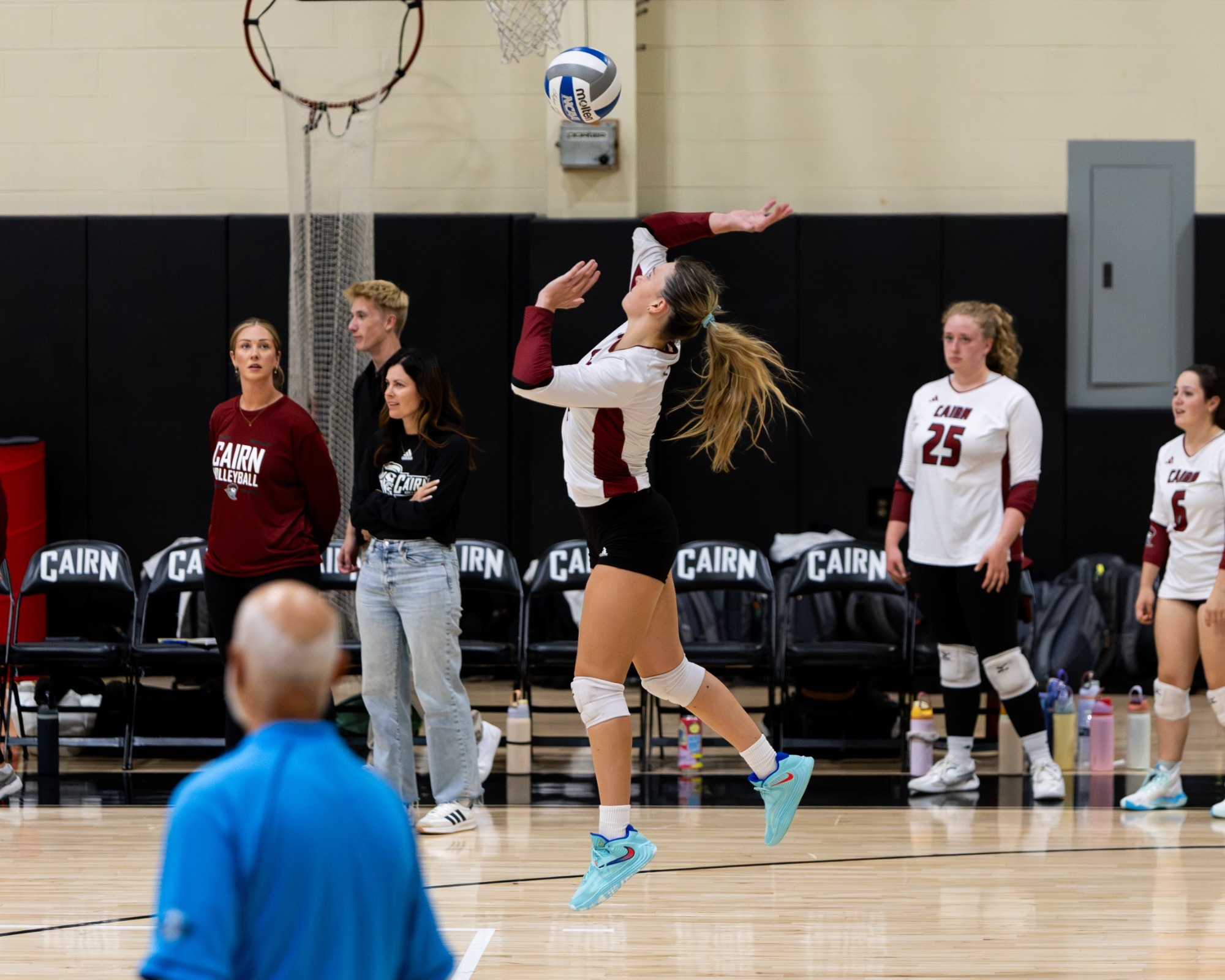 Cairn Volleyball player serves the ball