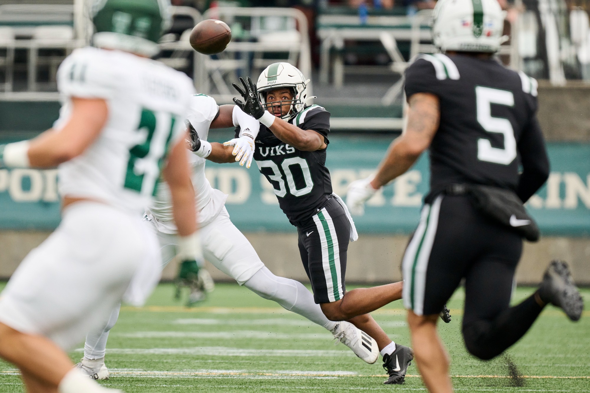 Travis West defends a pass against Cal Poly