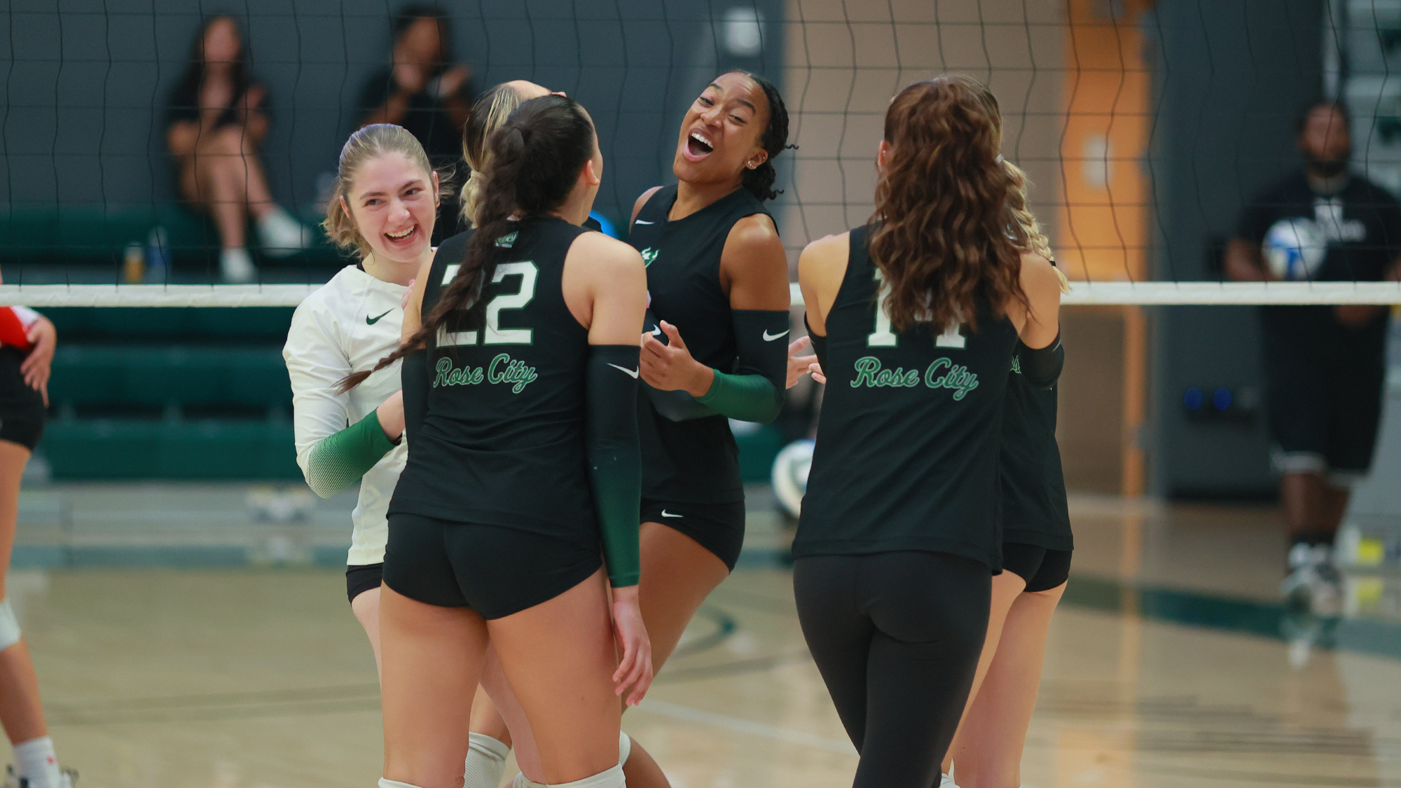 The Portland State volleyball team celebrates a point during its win over Utah.