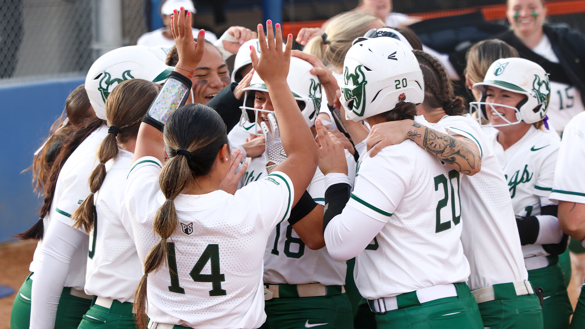 Softball team celebrates a home run against Idaho State