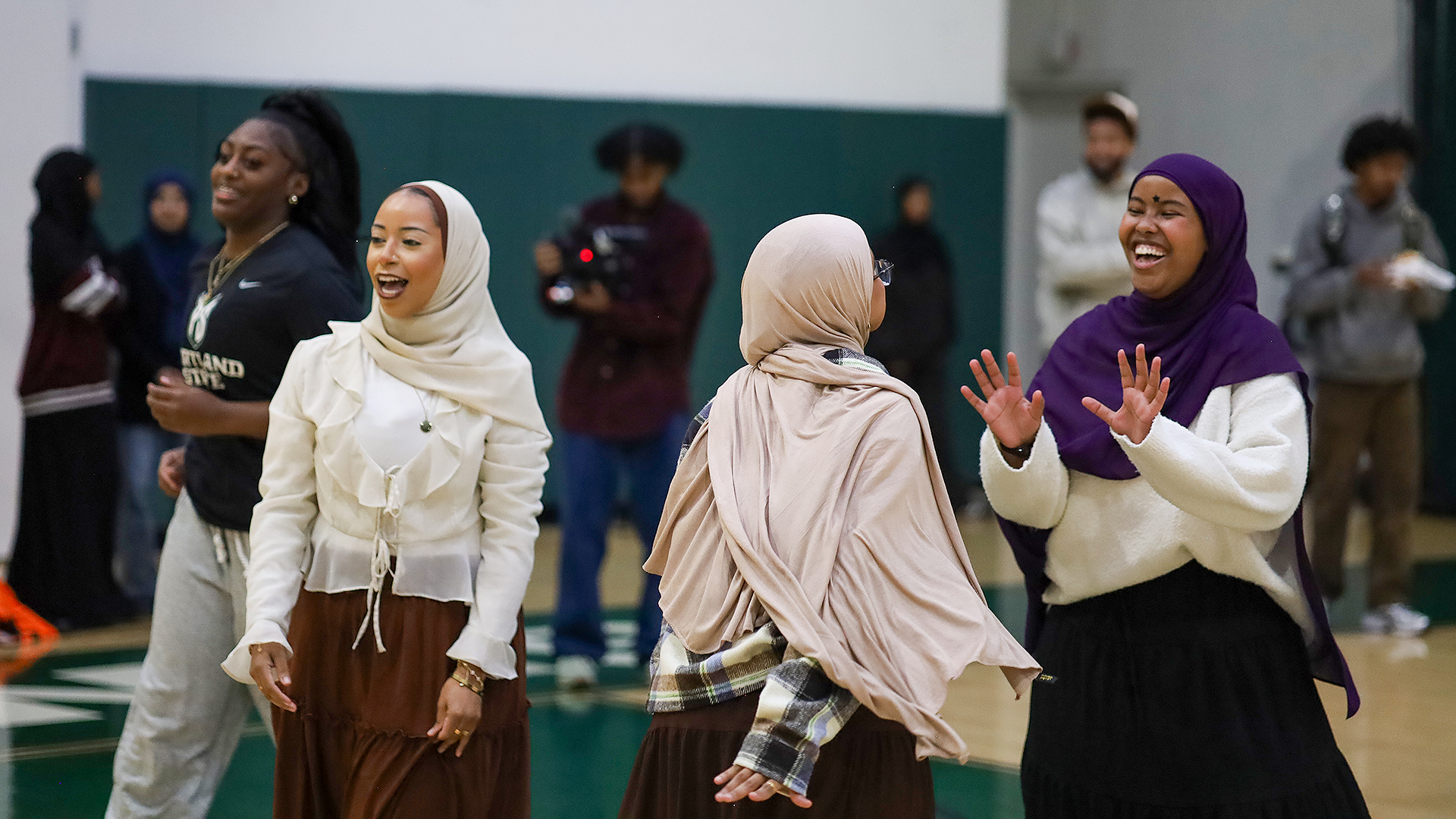 Students from the African Youth and Community Organization (AYCO) interact with Portland State student-athletes
