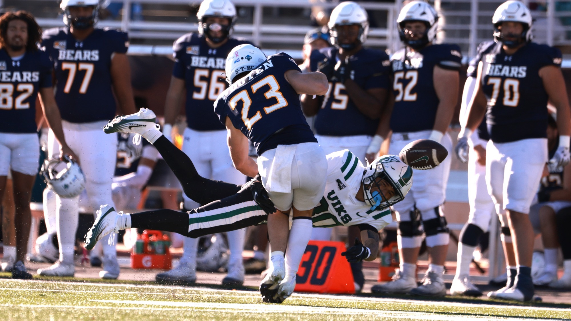 Lono Solomon knocks the ball loose from a Northern Colorado punt returner