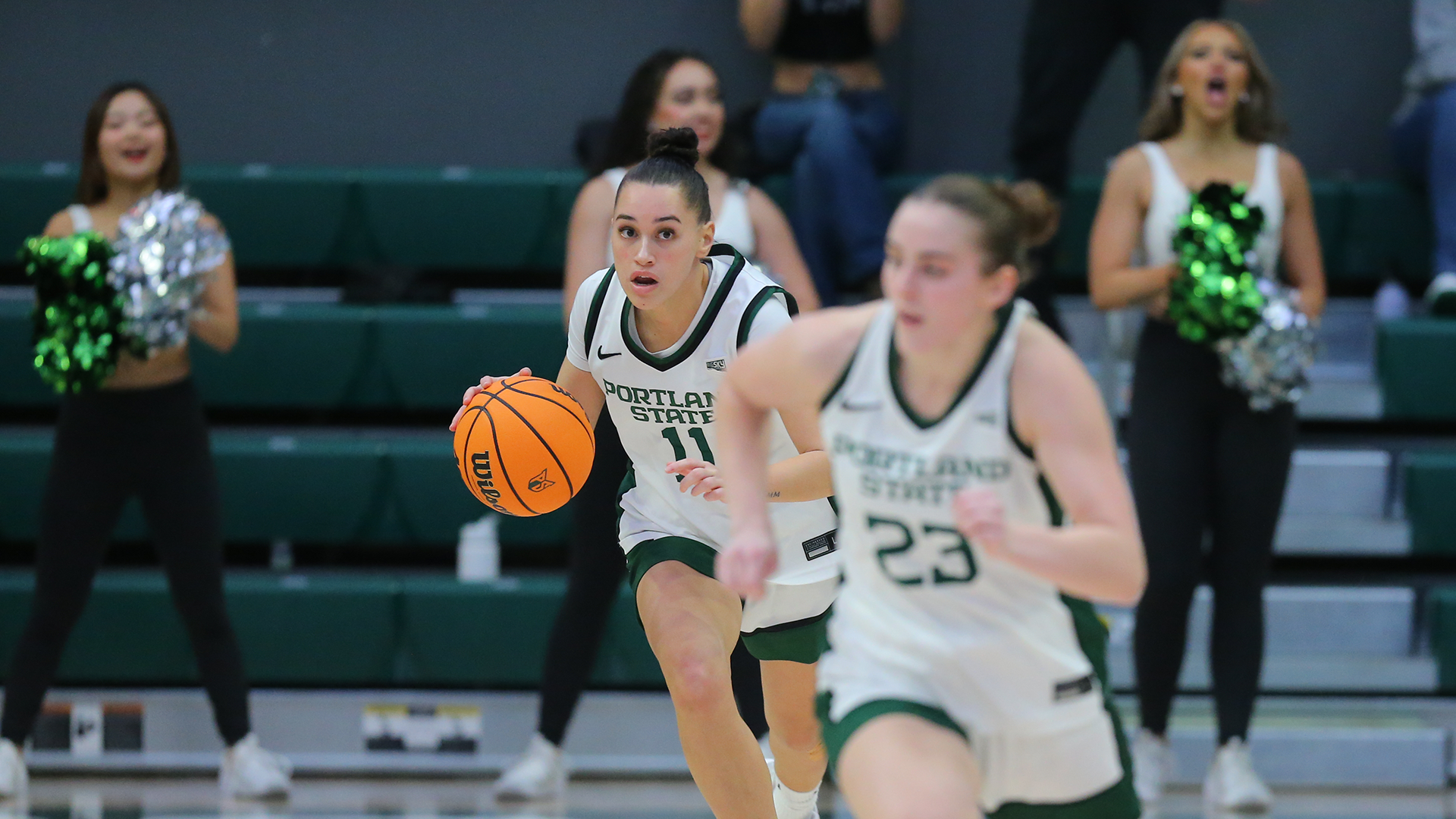 Portland State women's basketball player Laynee Torres-Kahapea looks ahead to teammate Taylor Moffat as the Vikings start a fast break during their game against South Dakota.