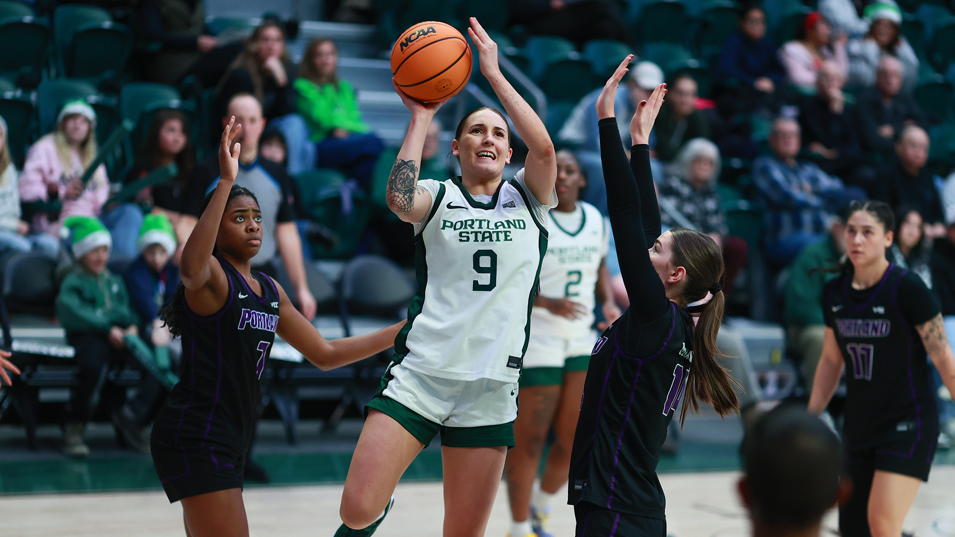 Portland State women's basketball player Hannah Chicken goes up for a contested layup during the Vikings' game against Portland.
