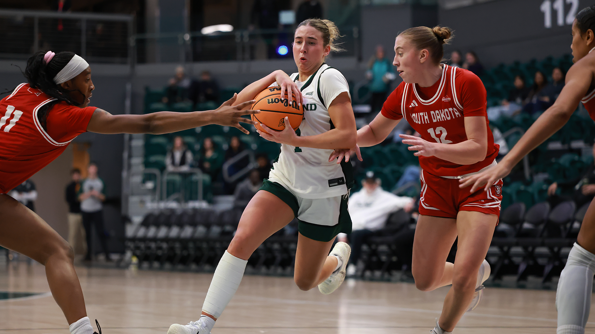 Portland State women's basketball player Sophie Buzzard drives into the lane during the Vikings' game against South Dakota.