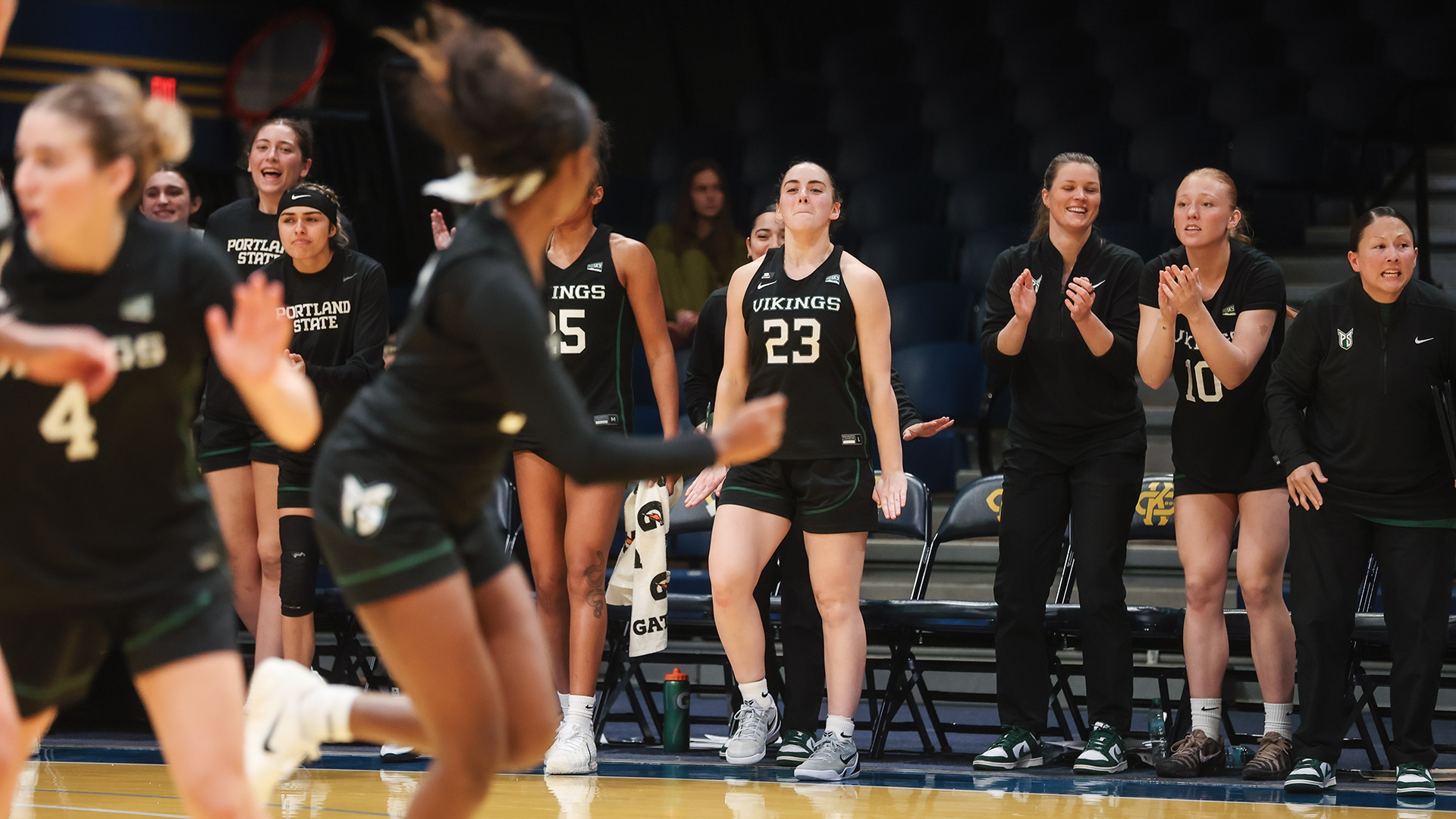 The Portland State women's basketball team's bench celebrates a basket during the Vikings' road victory over Kansas City.