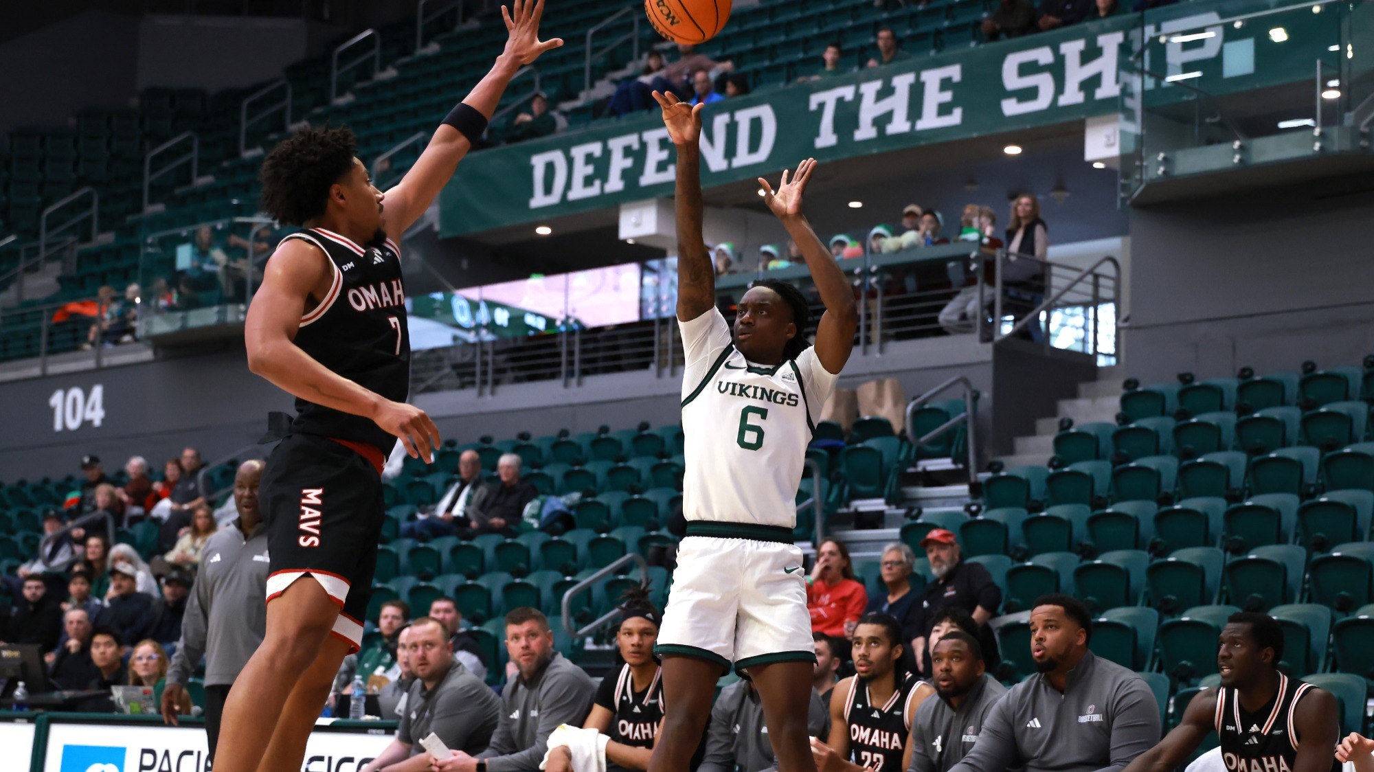 Sebastian Tidor fires a three-pointer against Omaha