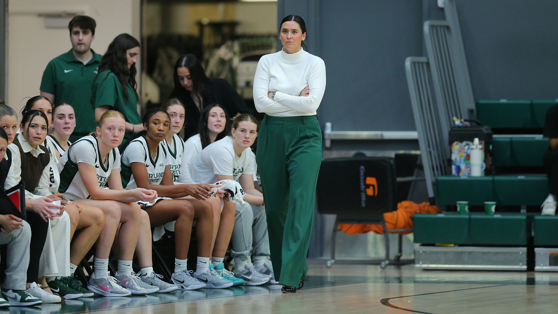 Portland State head women's basketball coach Karlie Burris patrols the sideline during a game.