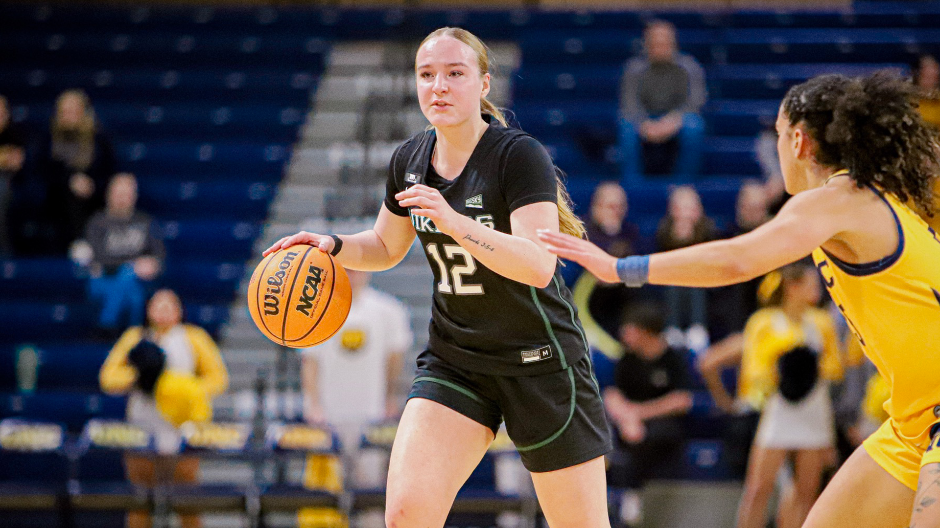 Portland State women's basketball player Kyleigh Brown dribbles the ball during the Vikings' road game at Northern Colorado