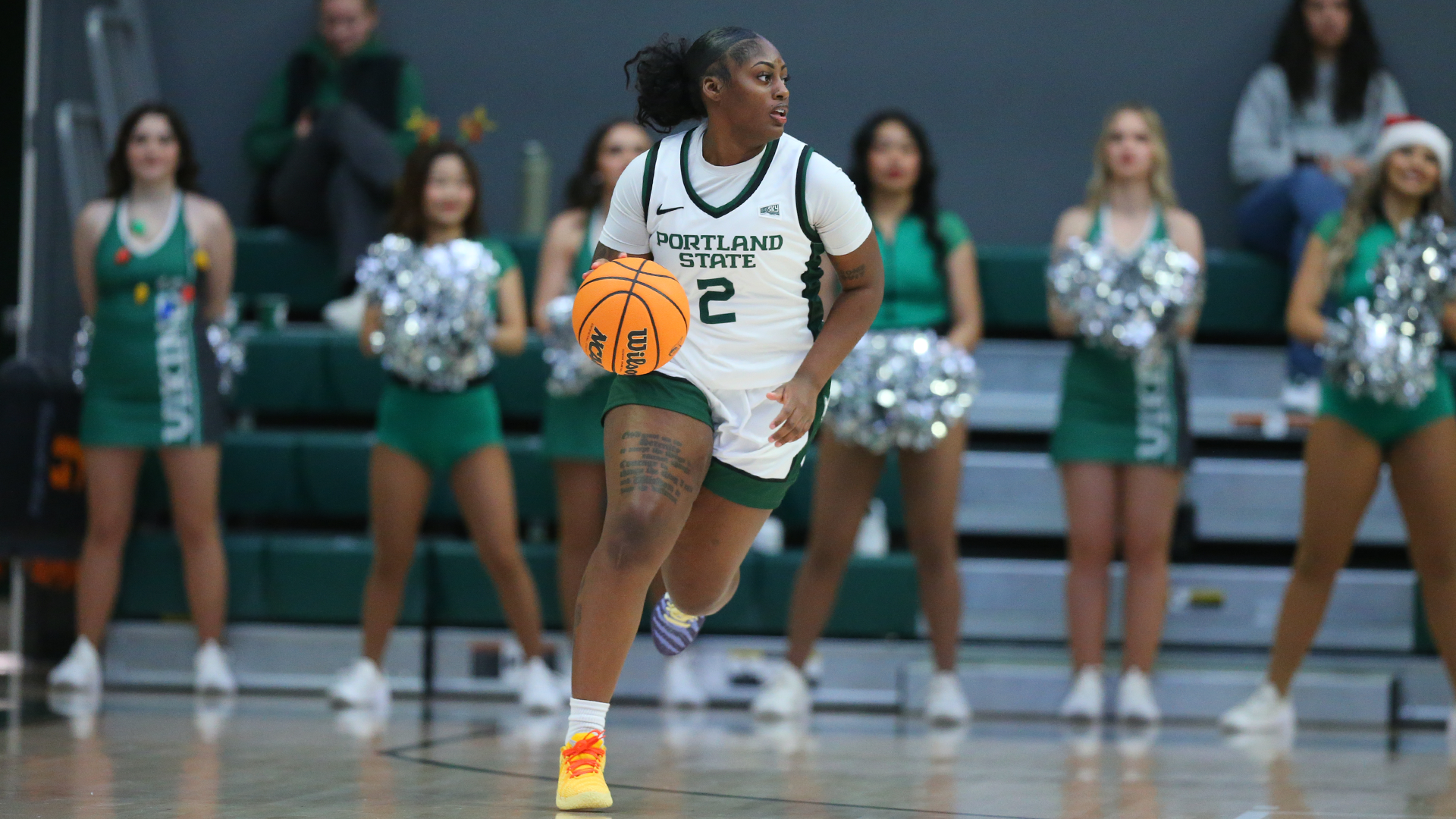Portland State women's basketball player Jamia Carter brings the ball up the floor during a game.