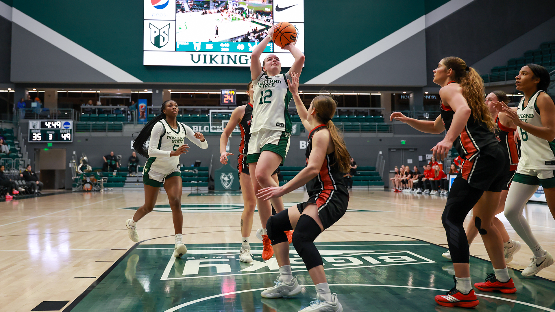 Portland State women's basketball player Kyleigh Brown rises for a jumper over an Eastern Washington defender during the Vikings' game against the Eagles.