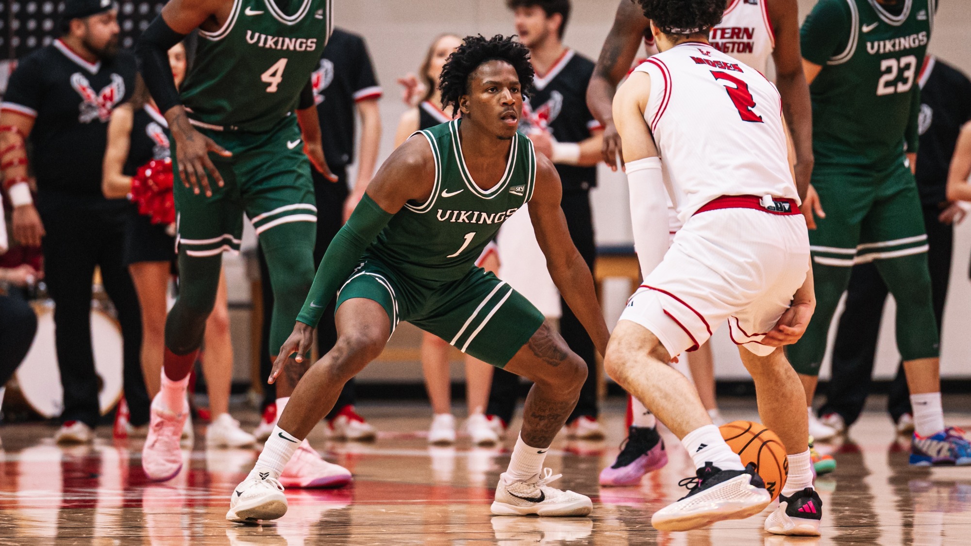 Kelcy Phipps defends an Eastern Washington guard in the Vikings 65-61 win over the Eagles on Thursday.