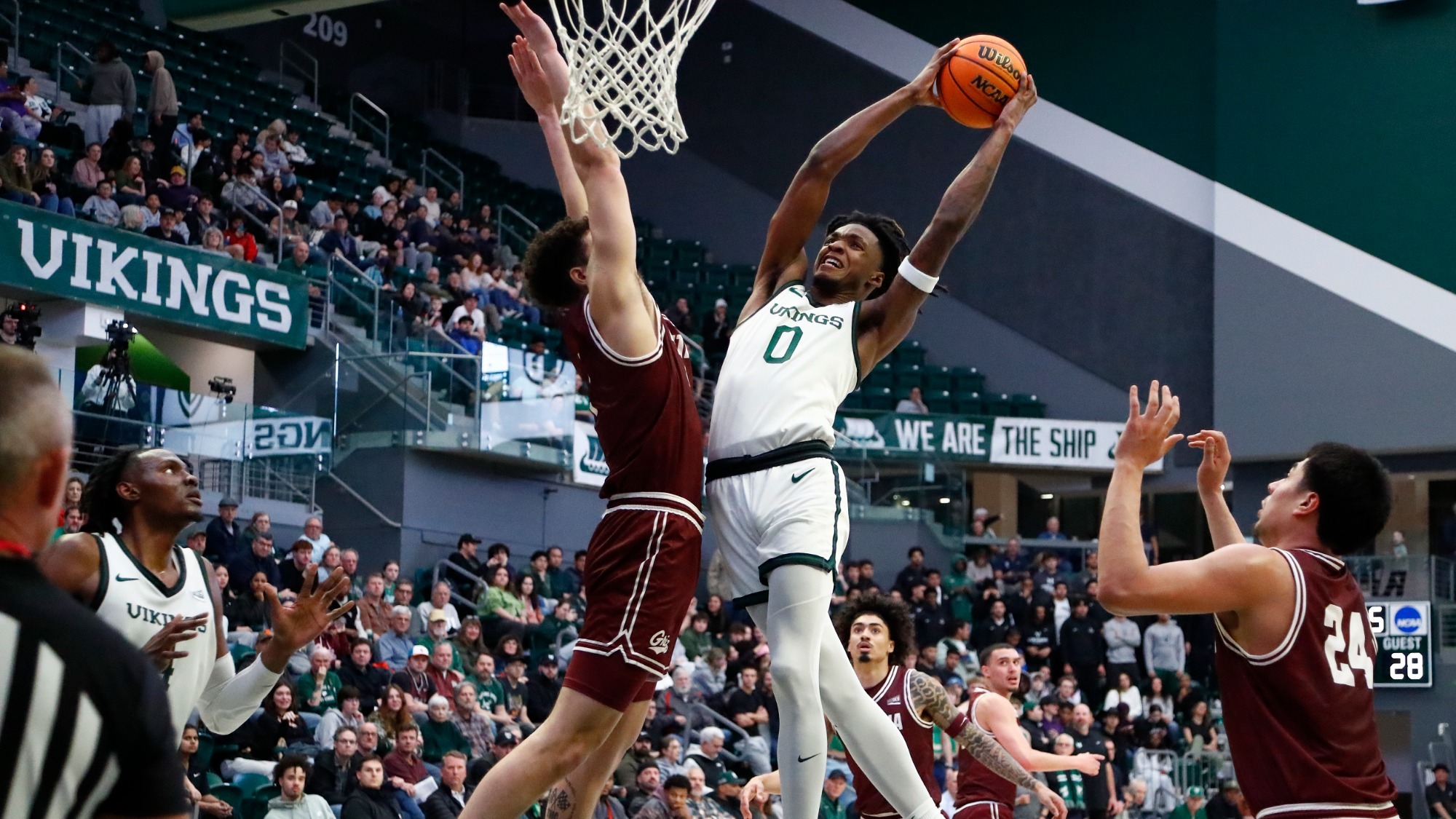 Keyon Kensie goes in for a dunk against Montana