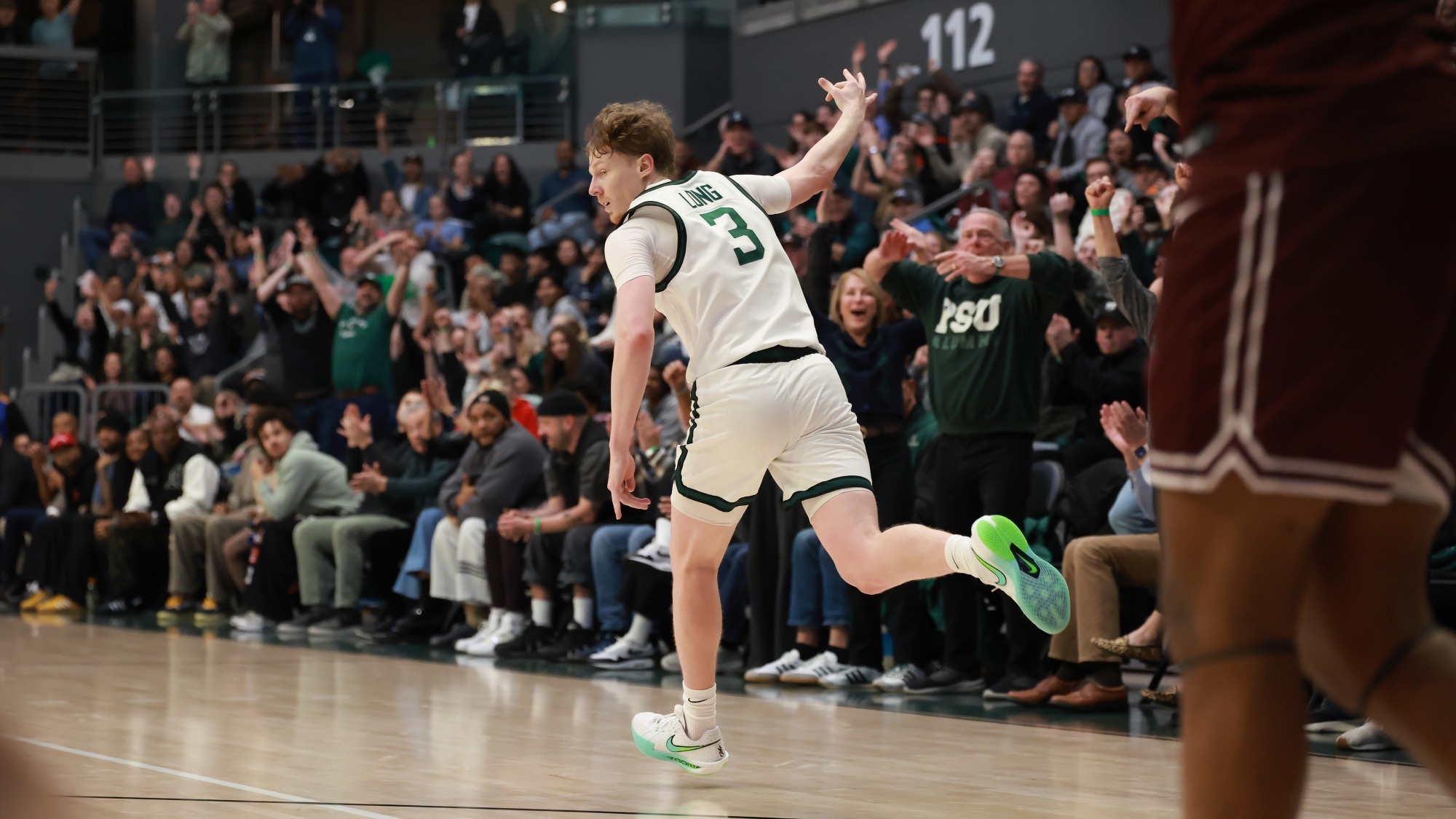Brycen Long holds up three fingers after hitting a trey