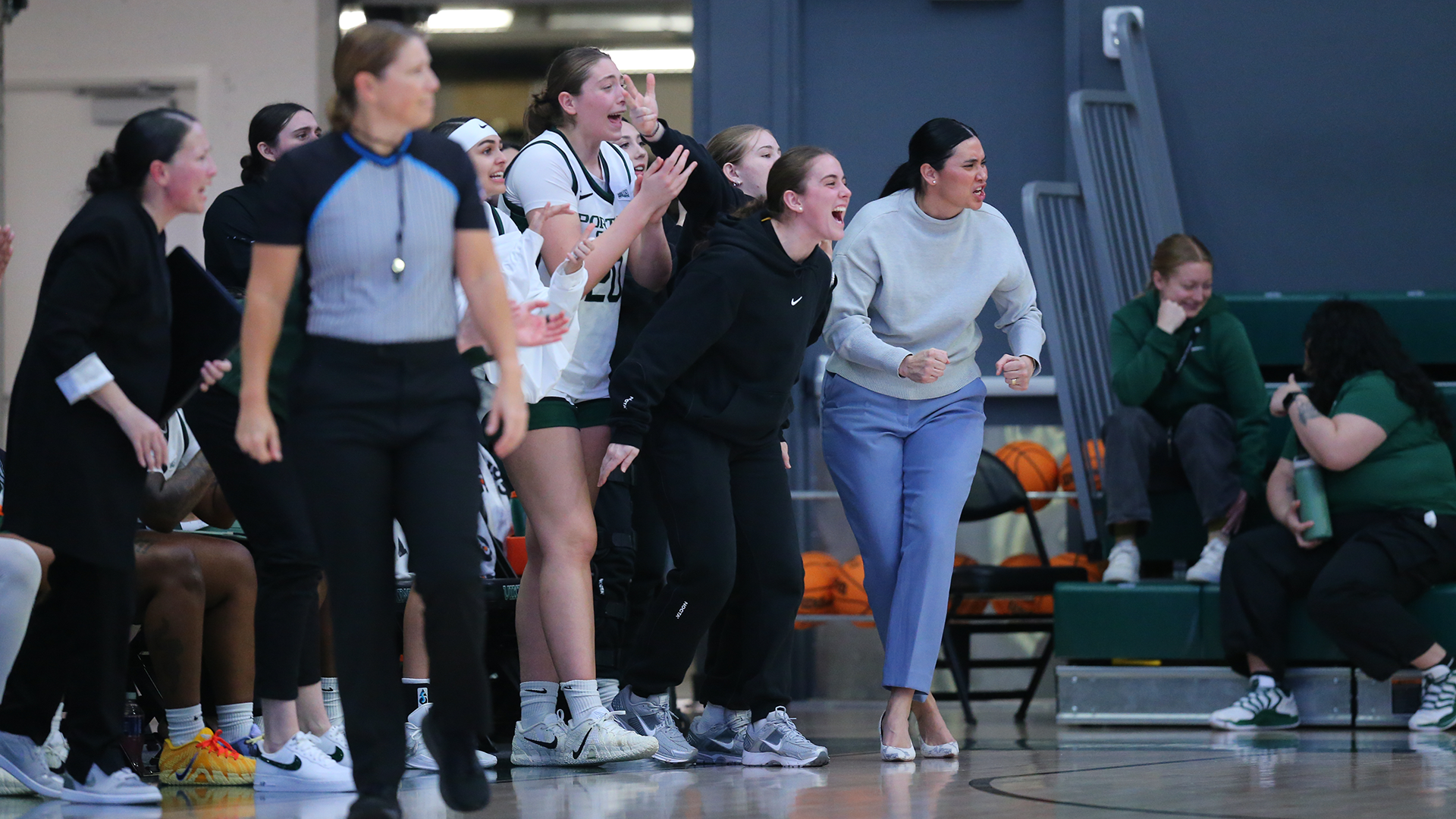 The Portland State women's basketball team's bench reacts to a play during the Vikings' home game against Idaho.