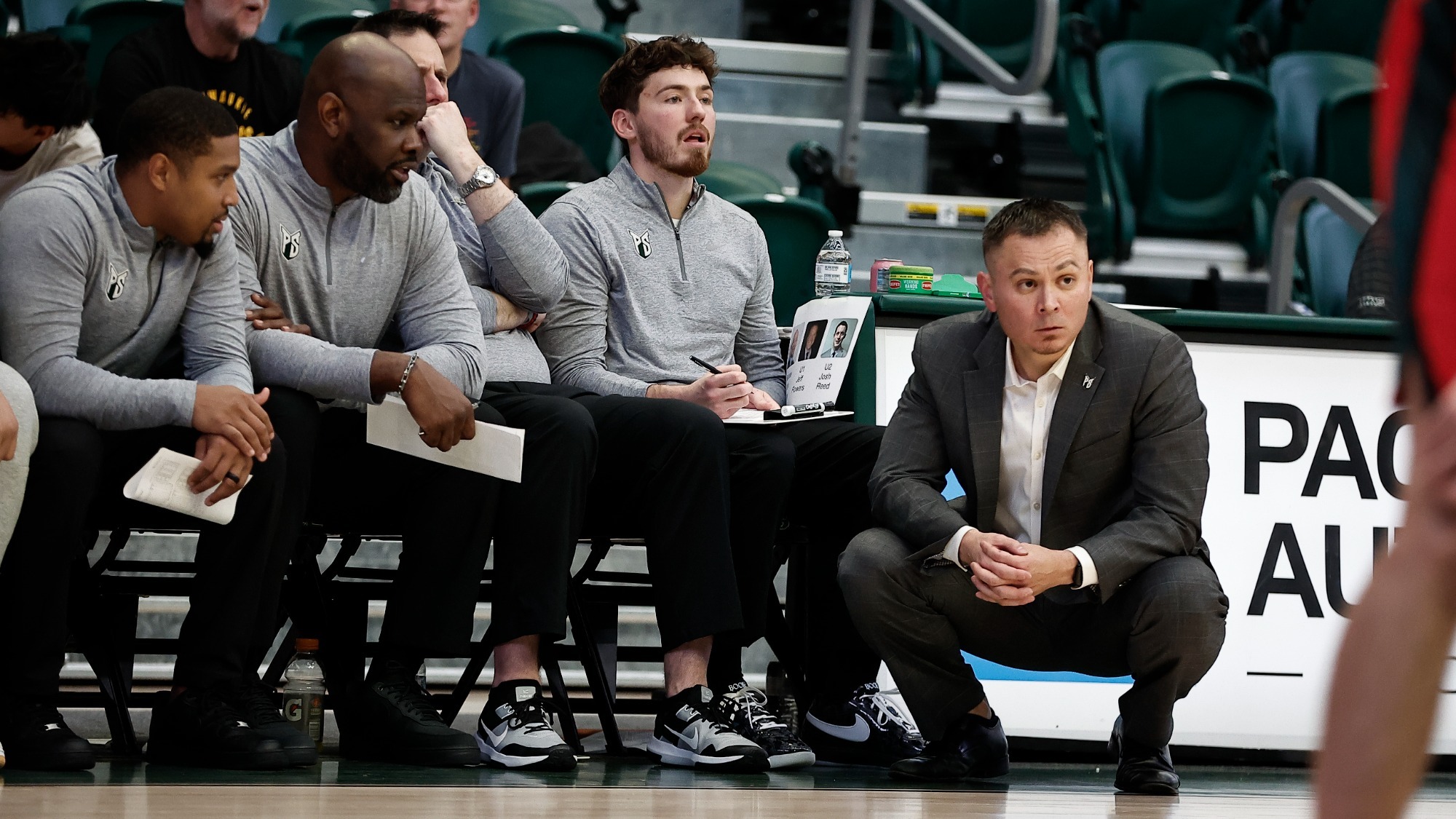 The Portland State Coaching Staff watches the Vikings in a game during the 2025-26 season.