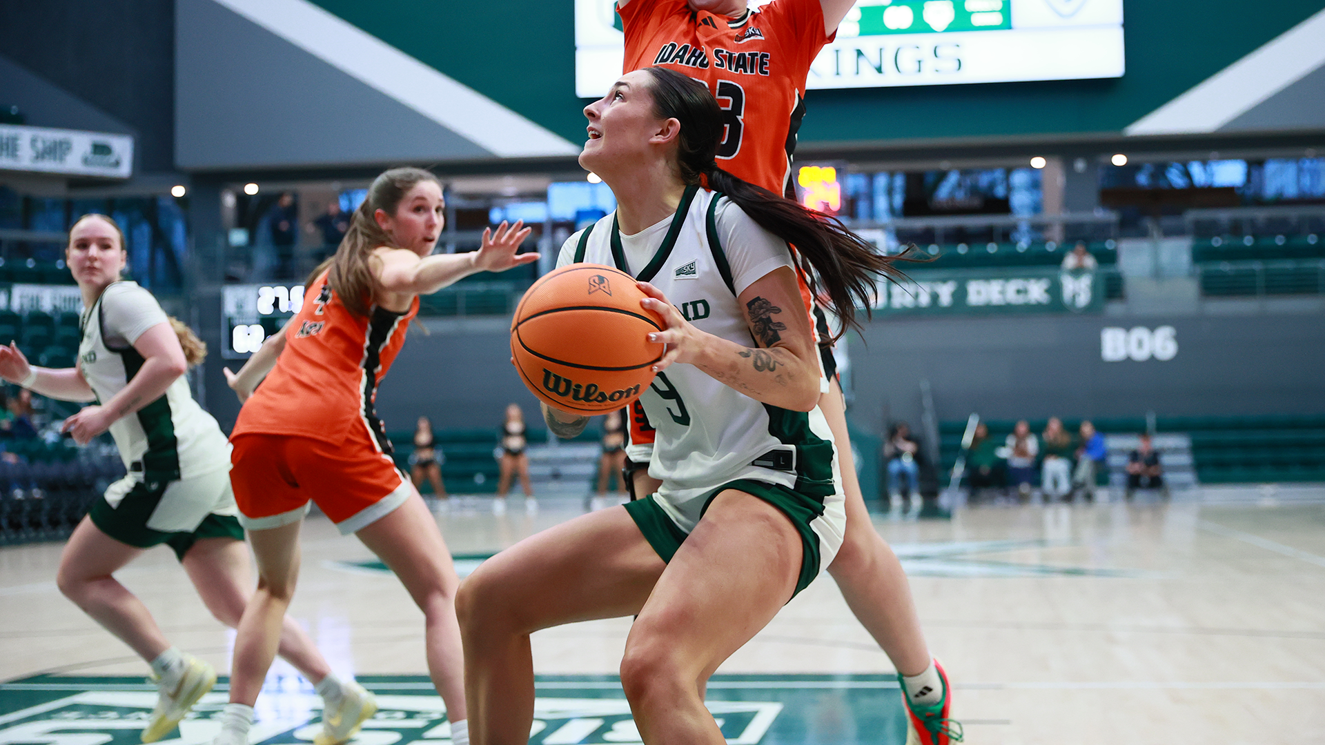 Portland State women's basketball player Hannah Chicken drives against an opponent during the Vikings' home game against Idaho State.