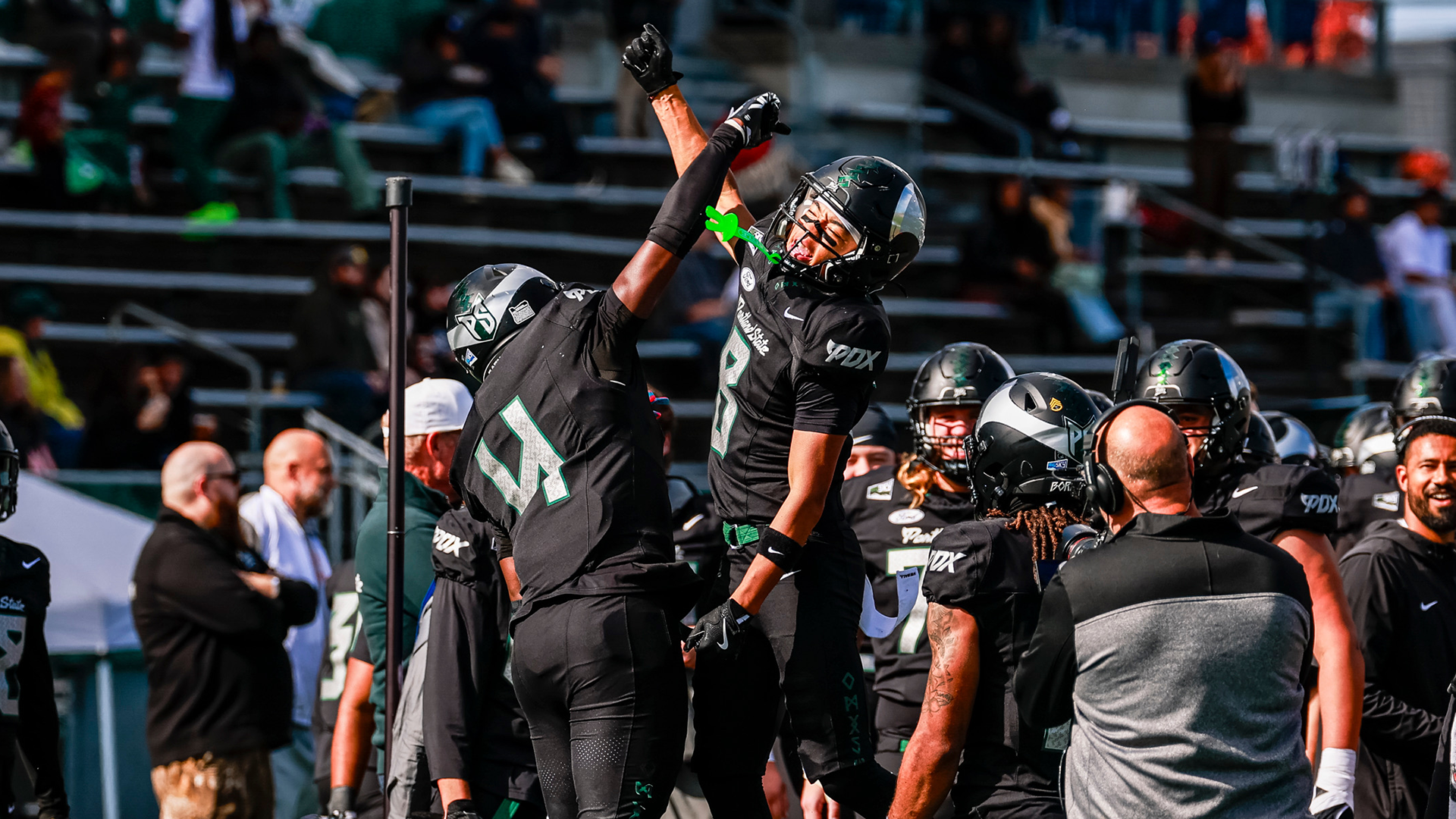Portland State football player Zui Shelton celebrates his first offensive touchdown with teammate Isaac Redford.