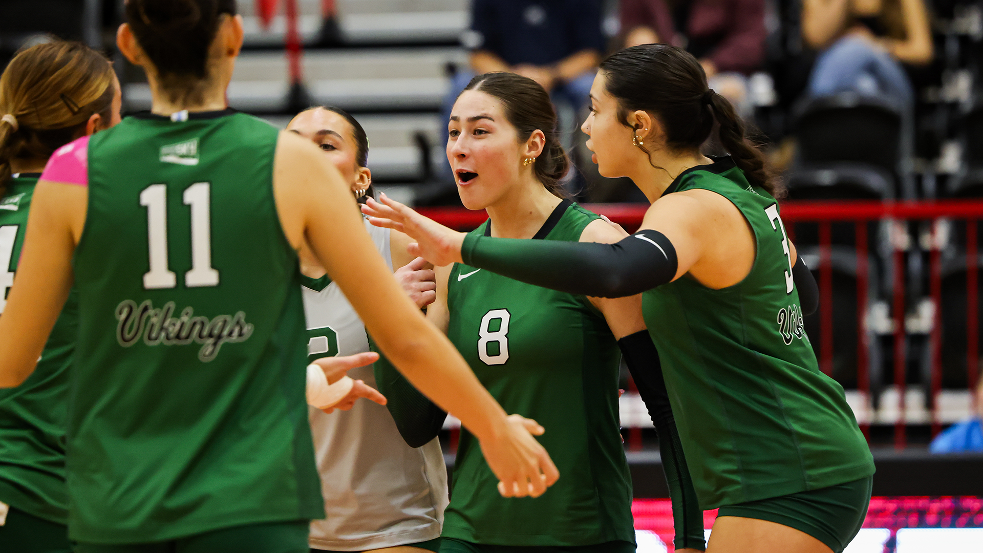Portland State volleyball player Maryn Hall celebrates with her teammates after a point during their match at Eastern Washington.