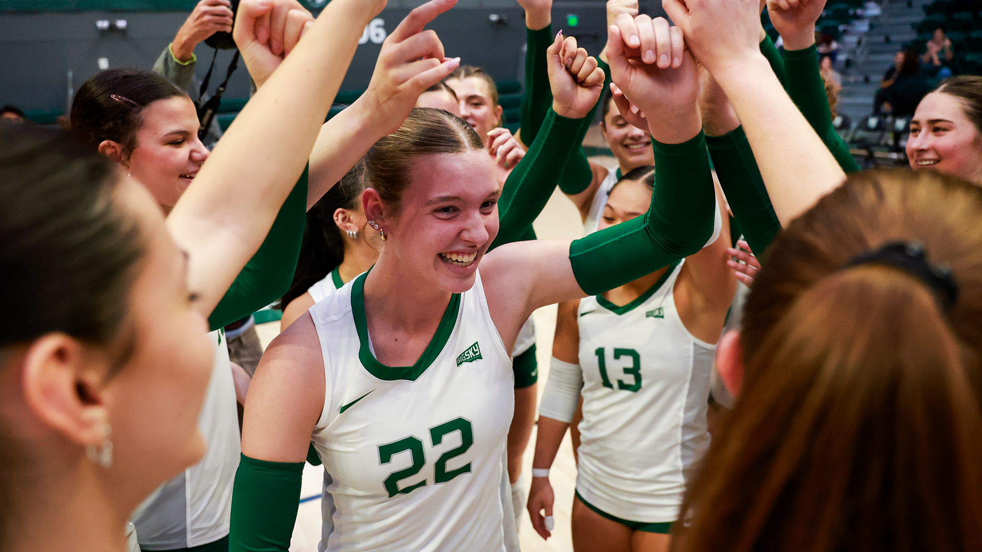 Portland State volleyball player Katelyn Davey celebrates with her teammates after a Viking win.
