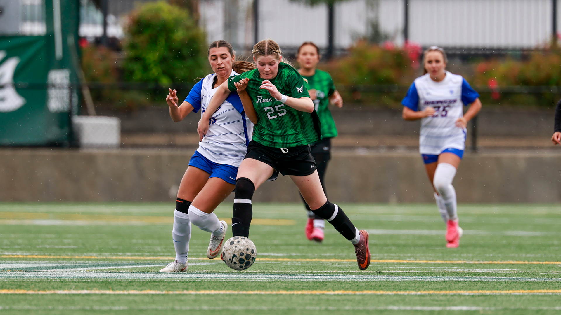 Portland State women's soccer player Alexi Cataldi battles for positioning against an opponent.