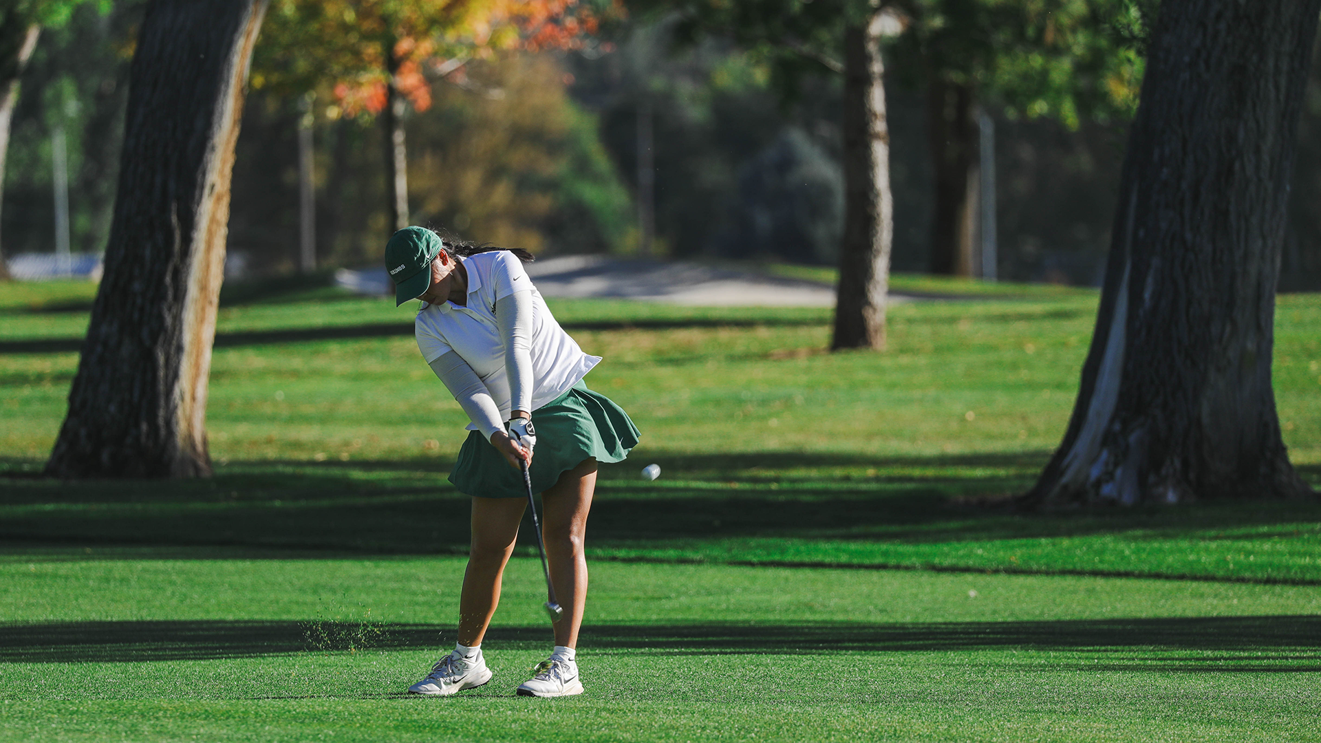 Portland State women's golfer Cynthia Valerie Ong swings through a shot at the Sun Mountain Intercollegiate