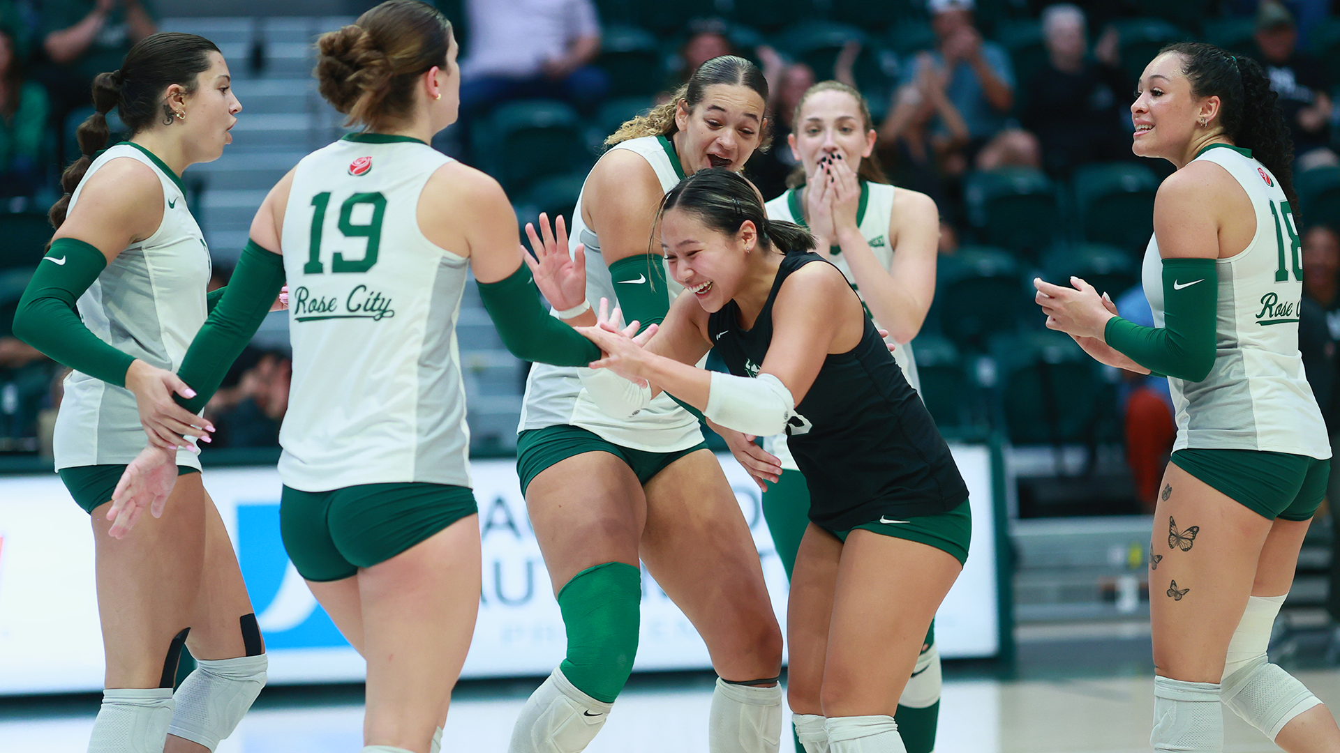 Portland State volleyball player Jessica Truong celebrates a point with teammate Ashley Repetti