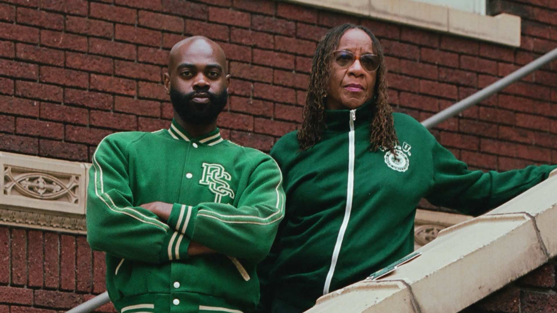 Former Portland State men's basketball player Vonte Carter poses with his mom Mary Tompkins in vintage PSU Athletics gear.