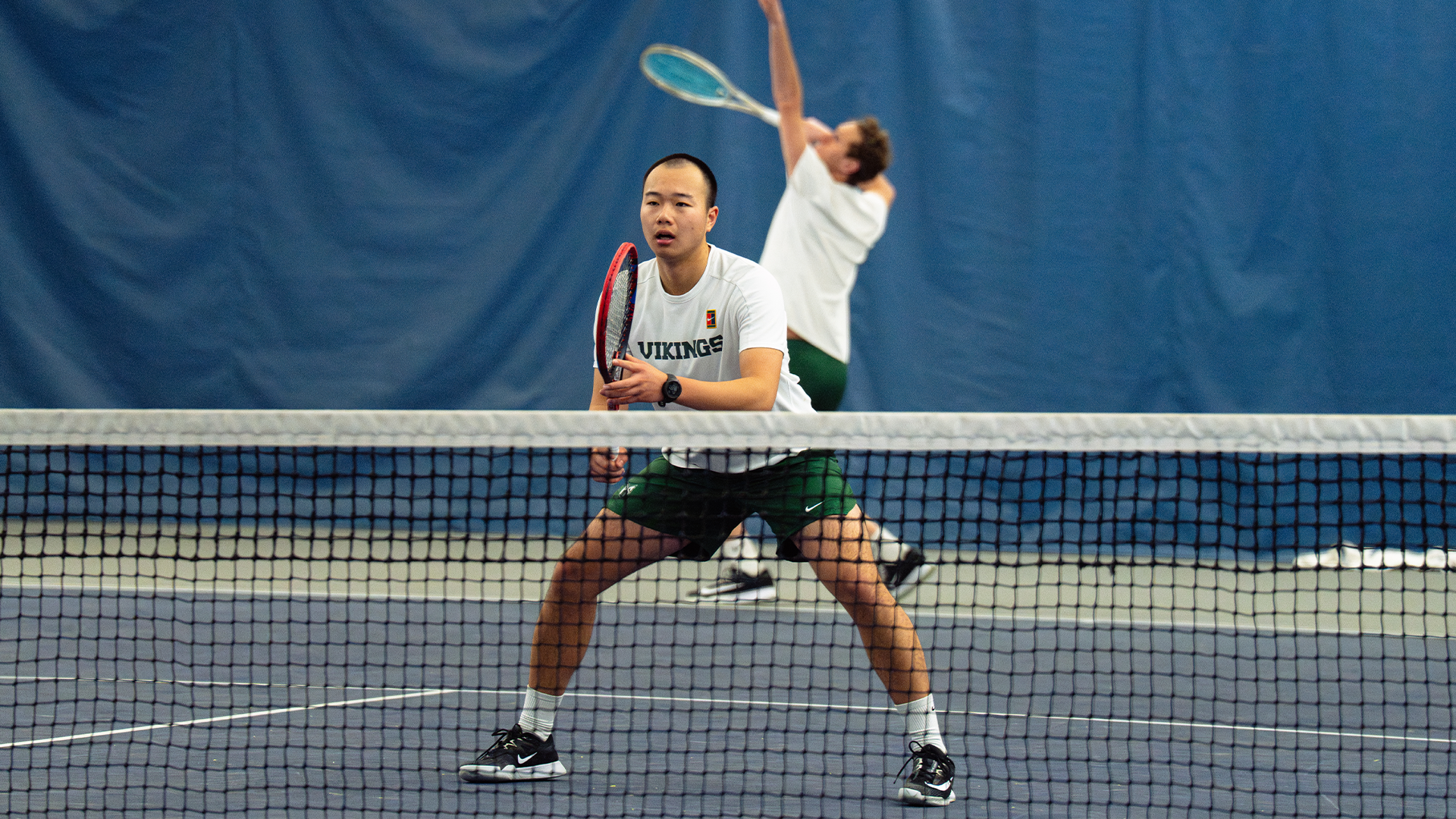Luke Lu in doubles action with partner Luca Prino at University of Portland 