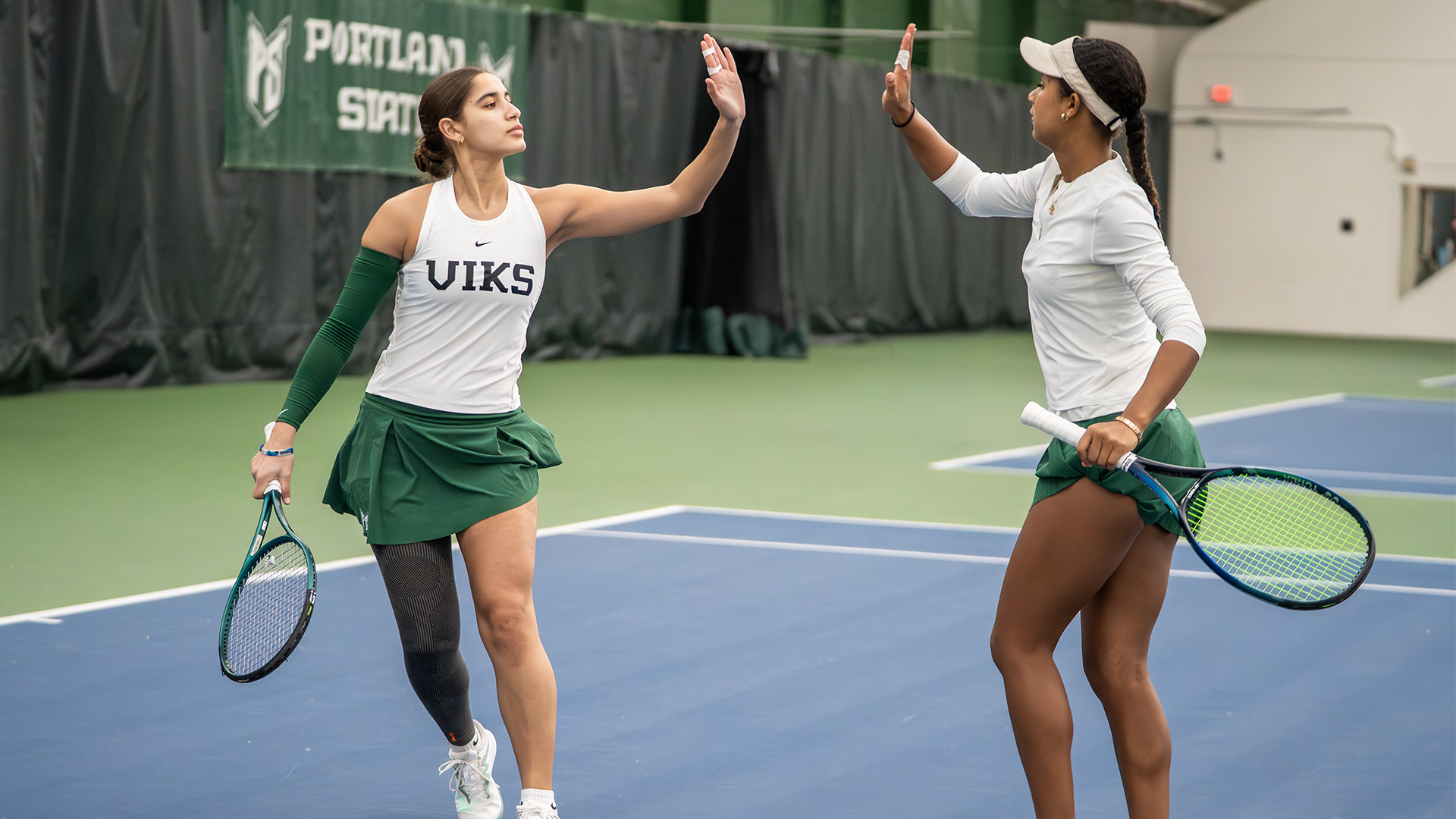 Hana Abdelhamid and Anjola Ige high five 